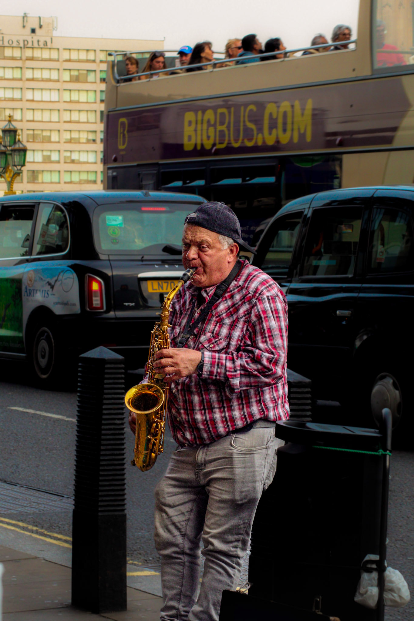 Gentleman playing the Saxophone outside Westminster station, London.
