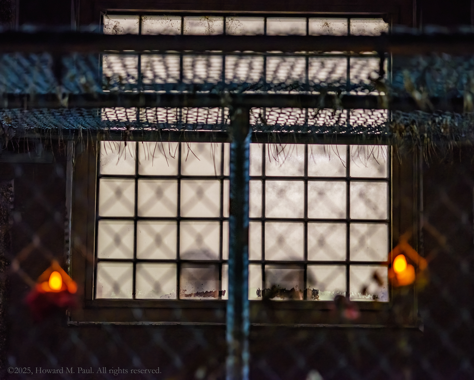 ICE detainees peer out a window during a Christmas Eve vigil outside, Aurora, Colo.