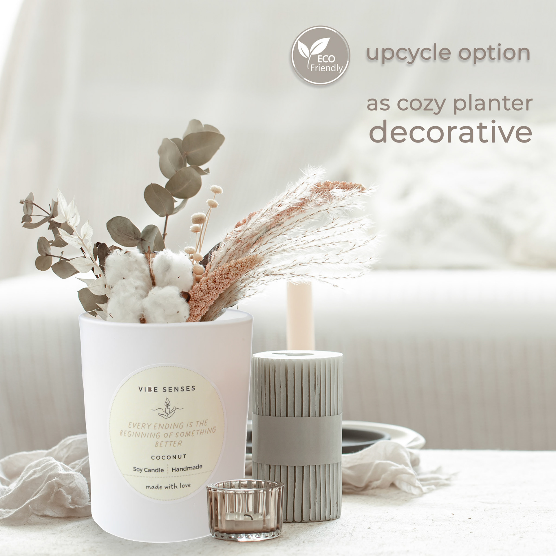 A minimalistic composition in the Scandinavian style with dried flowers in a vase and candles.