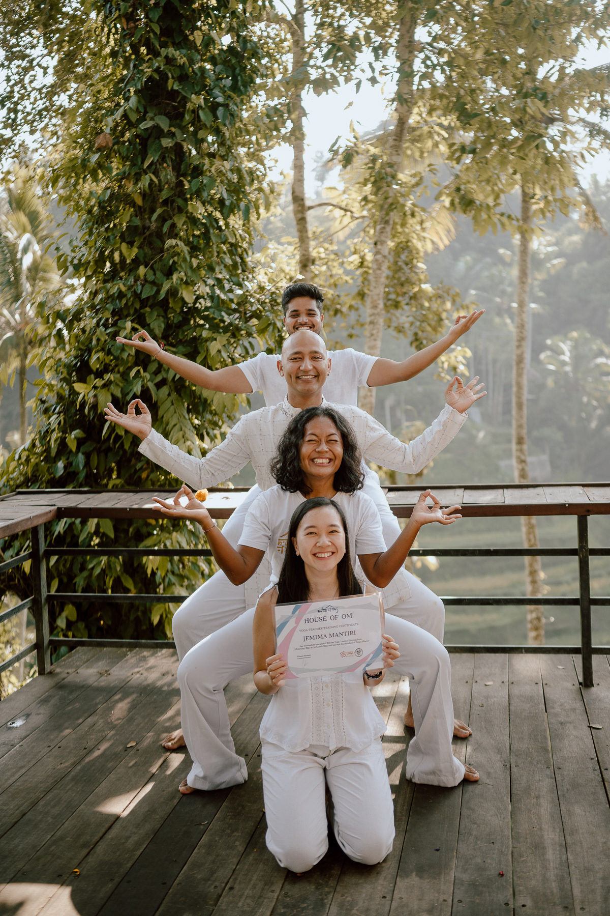 Jem, the yoga teacher behind The Mindfully, with 3 of her teachers in a goddess pose after her yoga teacher training in Bali.