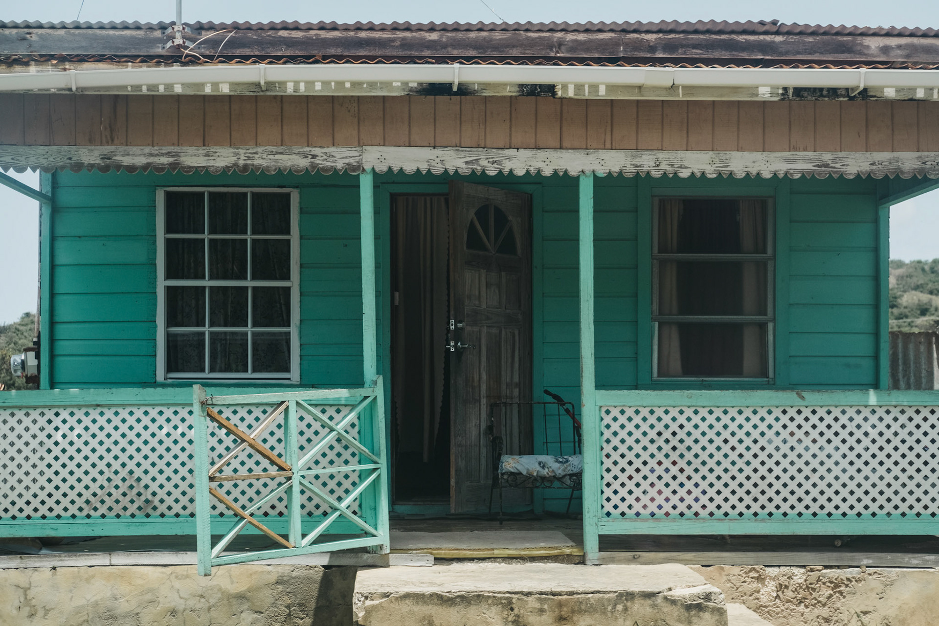 Traditional bright-coloured house in Speightstown, Barbados, one of the islands major towns famous for street vendors.