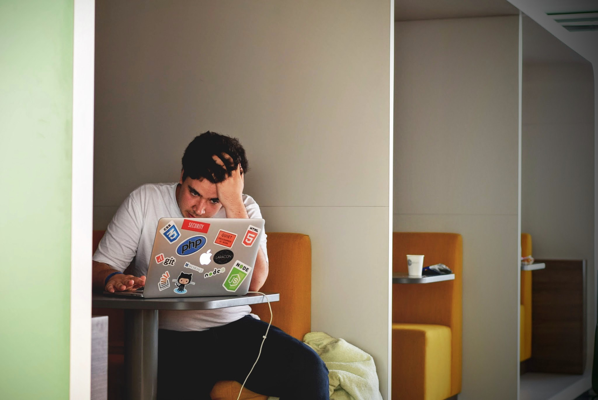 University student staring at a computer while looking frustrated