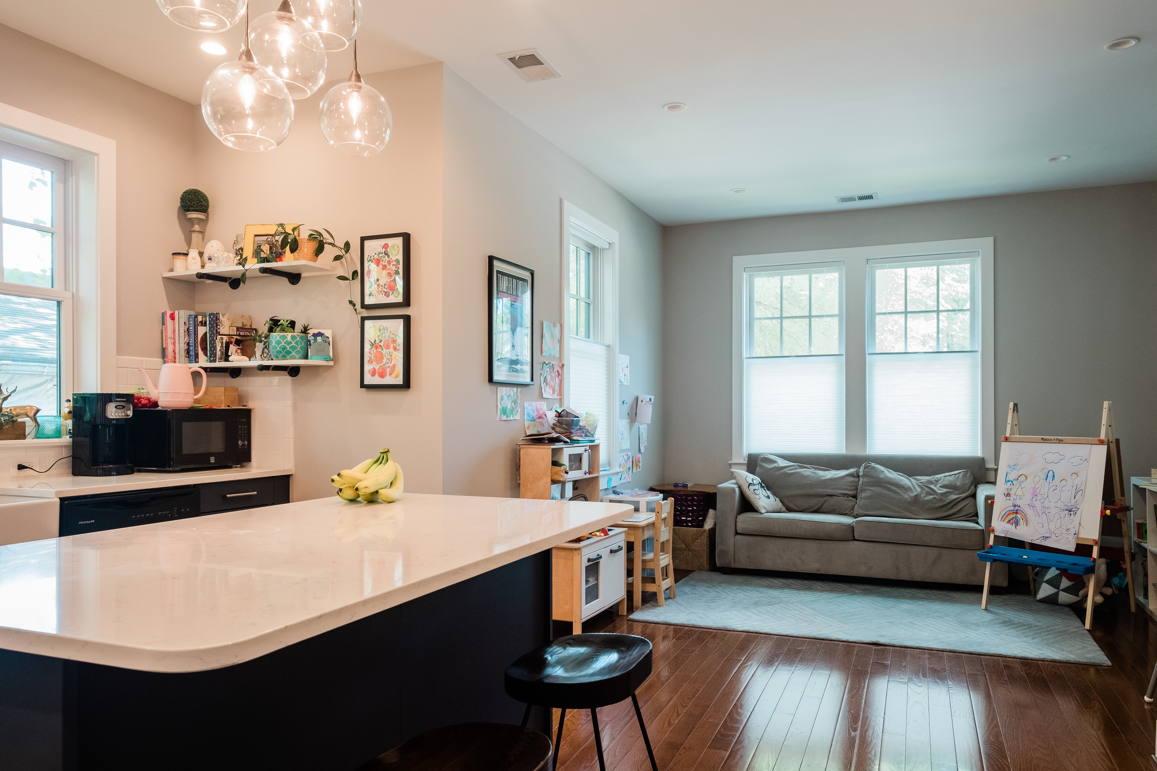 The flexible space off of the kitchen is perfect for a play space for littles now and entertaining later.