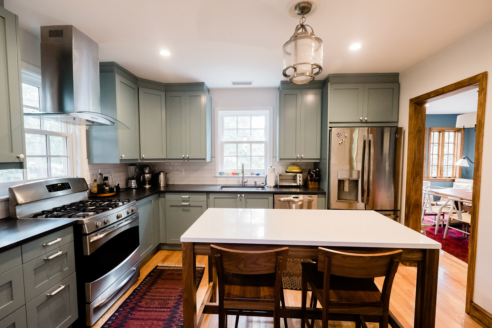 The new kitchen flows beautifully into the new dining room addition.
