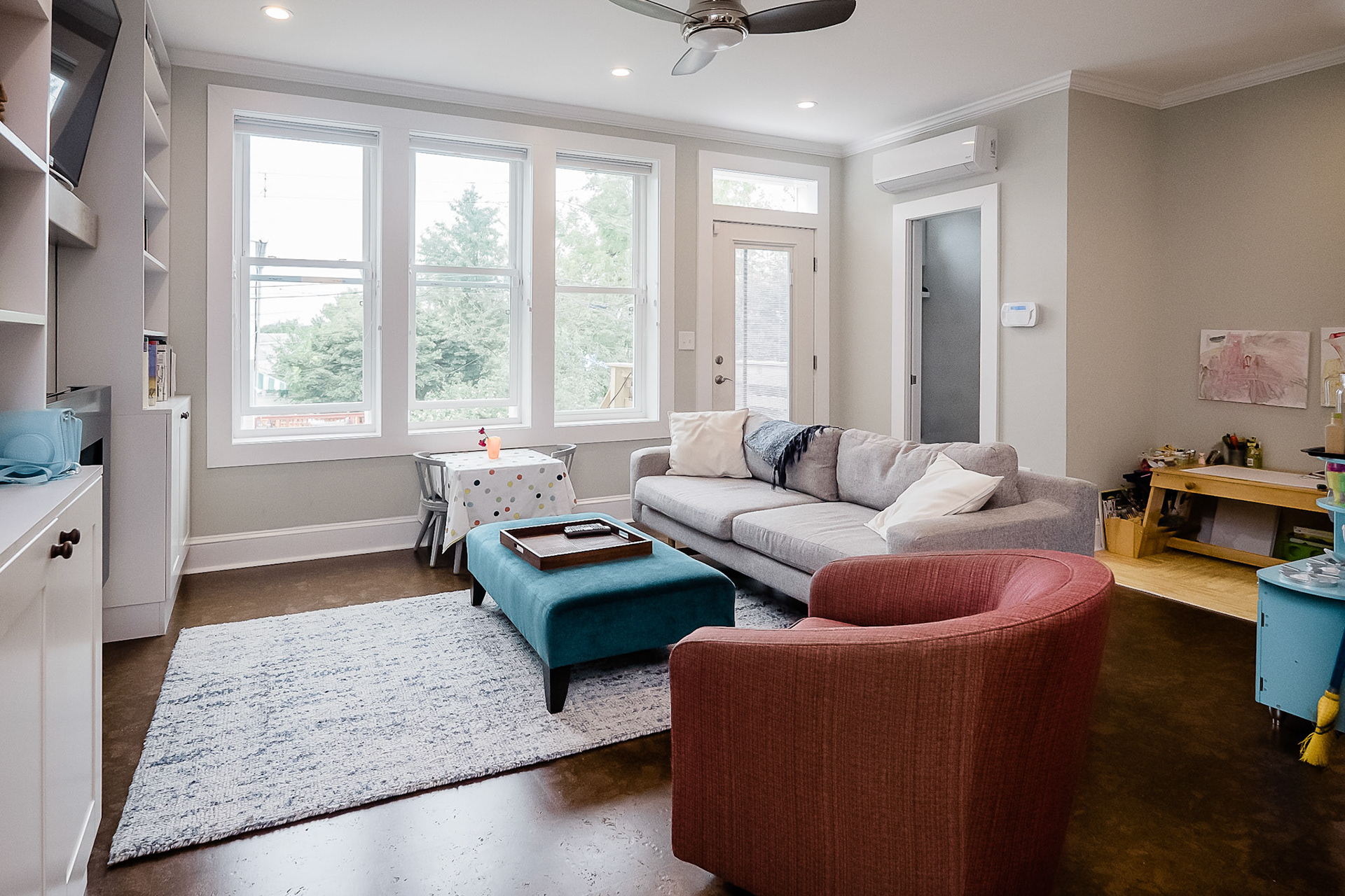 The family room connected to the rear yard through large windows and access to the rear deck.