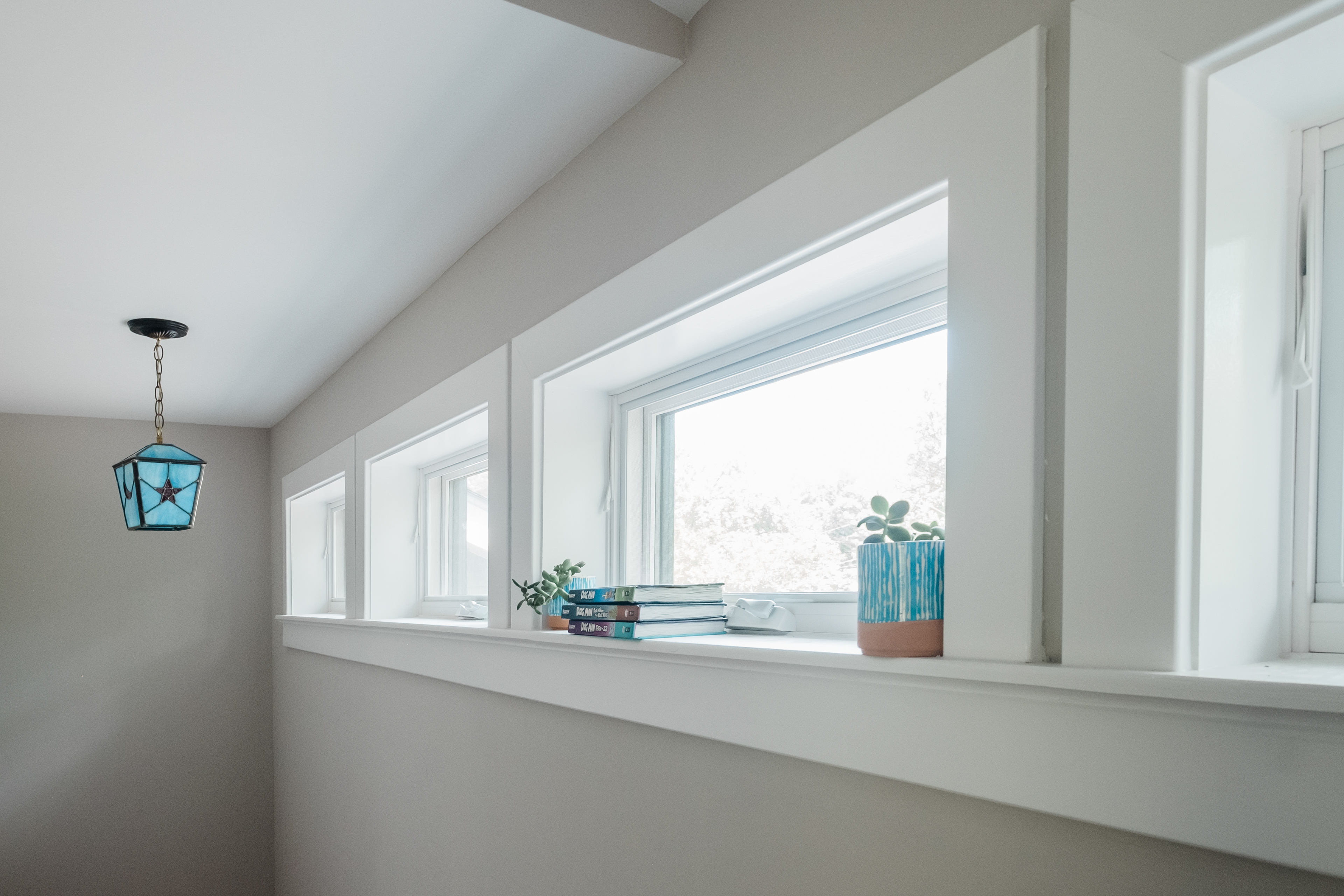 Clerestory windows bring light into the new stairway and down to the living room.