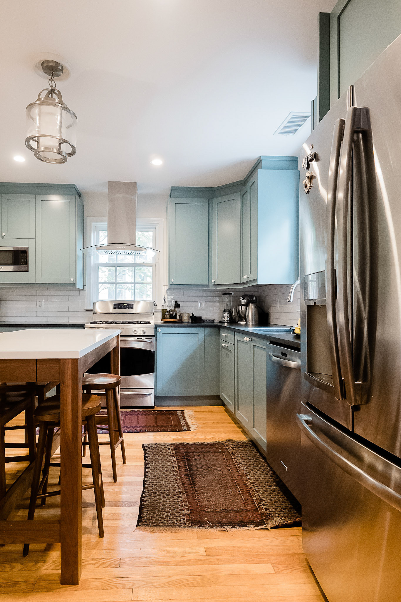 A tall center table works perfectly for family seating and extra work surface.