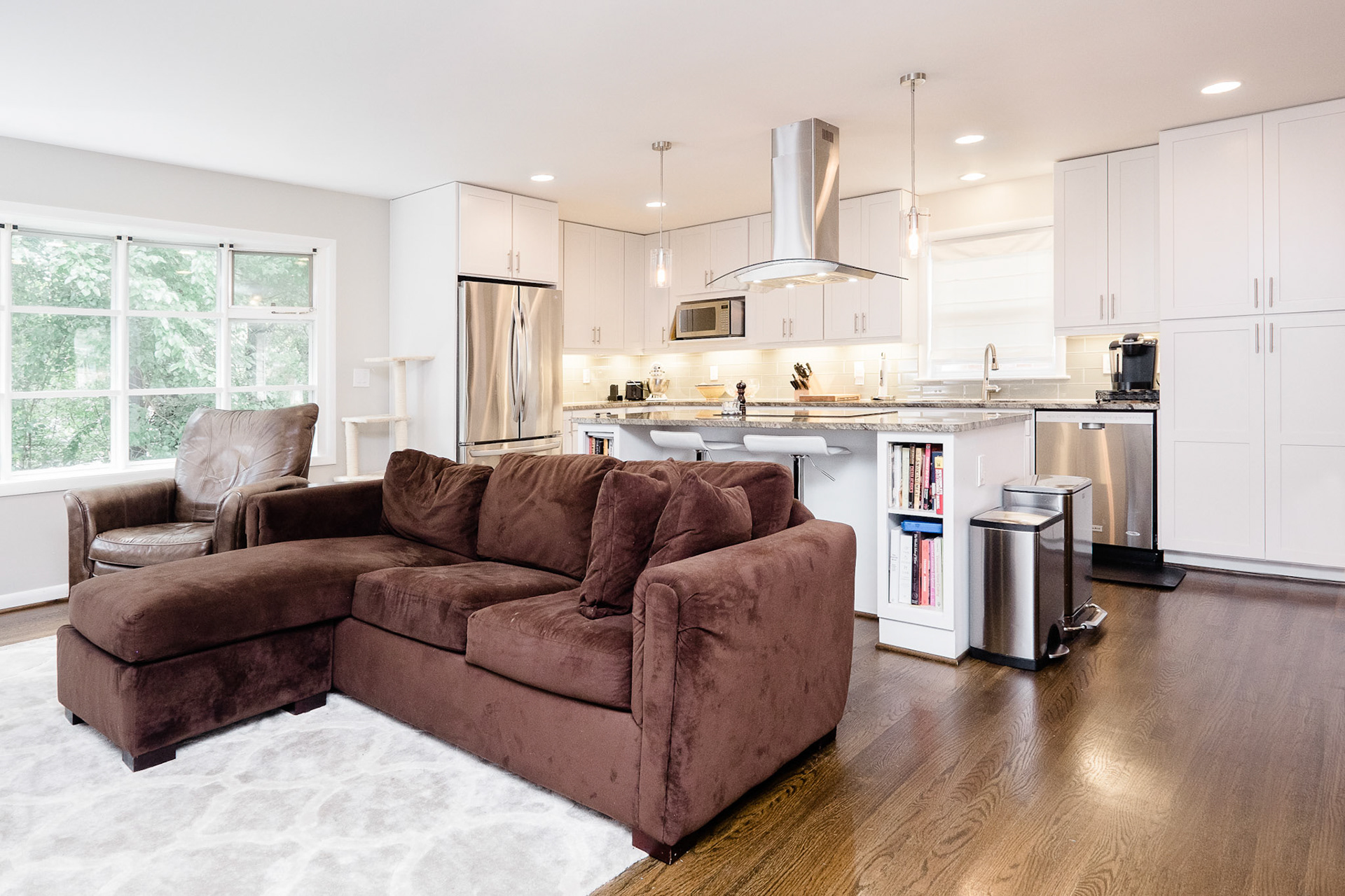 The living room and kitchen are open to each other for a family that loves to cook and eat together.