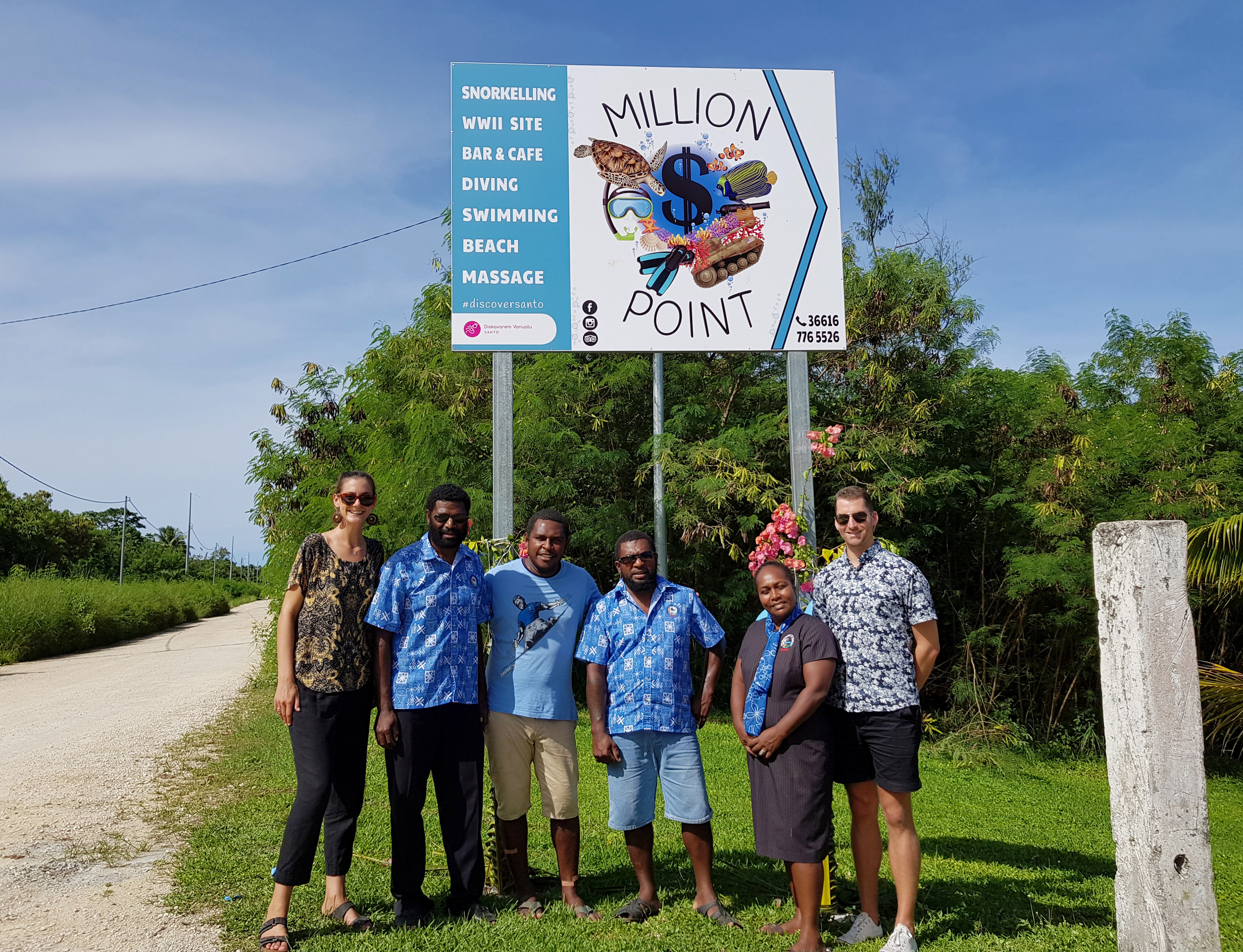Signage seen here with my Dept. of Tourism team and the client