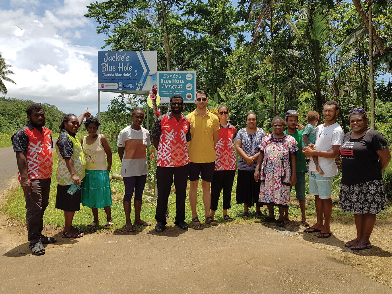 Road side signage seen here with the Tourism team, rep. from NZ Volunteer Services Abroad, the clients and families
