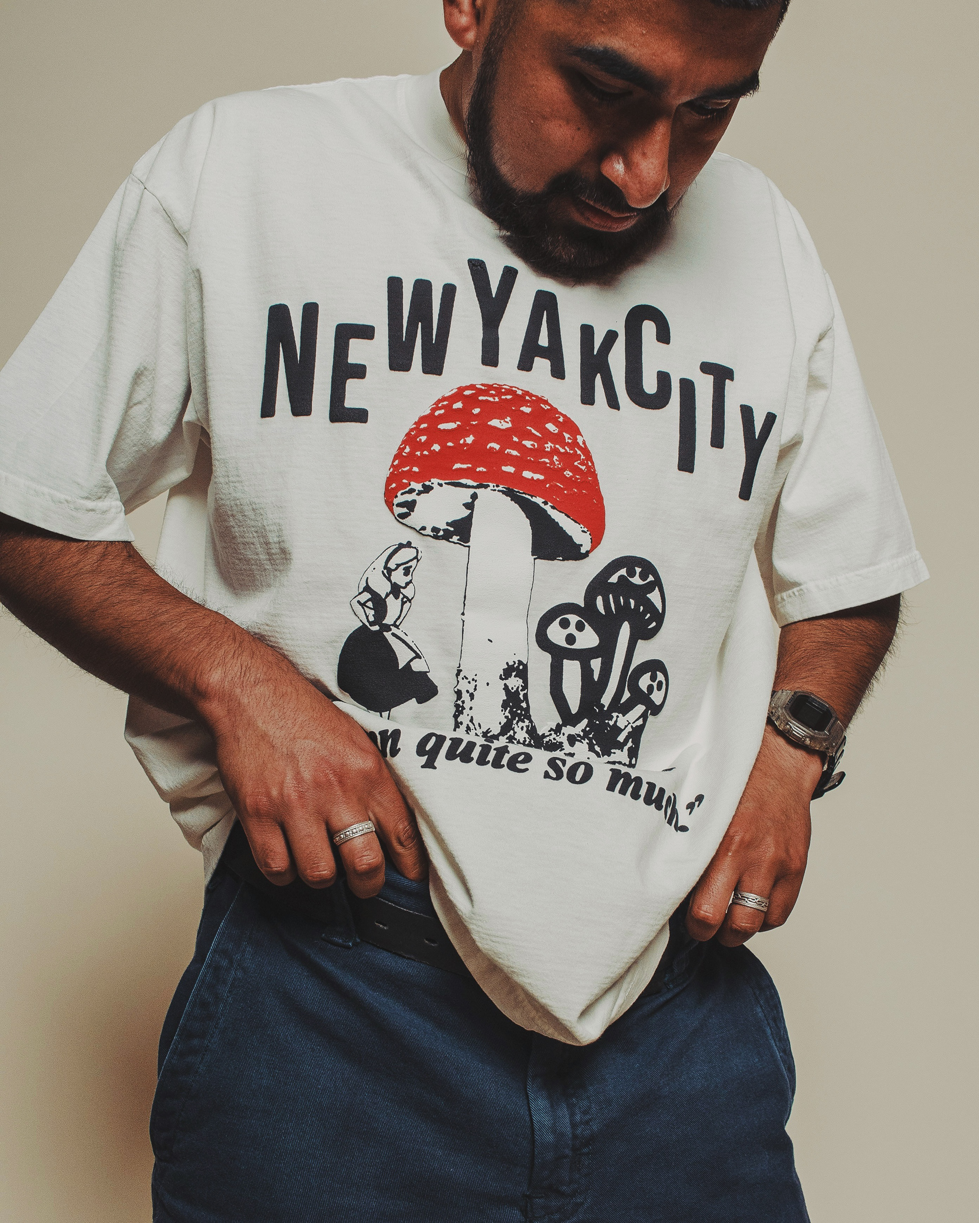 On model studio photo of the special edition New Yak City tee for the Stingwater x SB Dunk release.