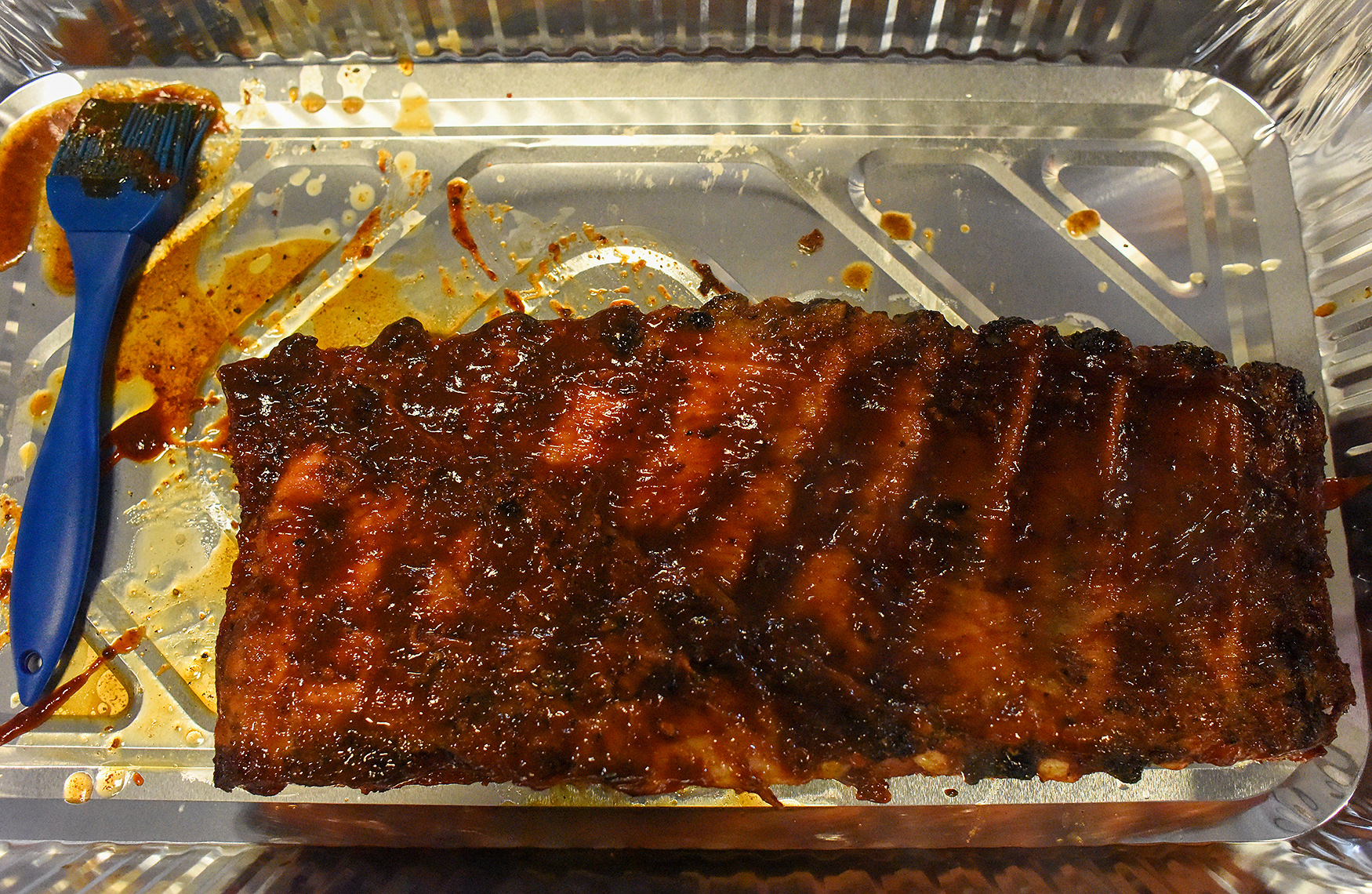A student's ribs sit in a tray on March 2 at Hallsville High School. Students watched YouTube videos on how to present their ribs to judges while their ribs were cooking.