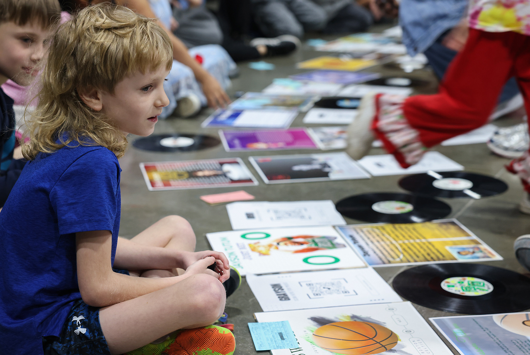 Grayson Tawfall, 8, explains his research on NBA player Jayson Tatum at the art gallery on March 20 at Locust Street Expressive Arts Elementary in Columbia. Grayson created a playlist for his project with some of his favorite musical artists.