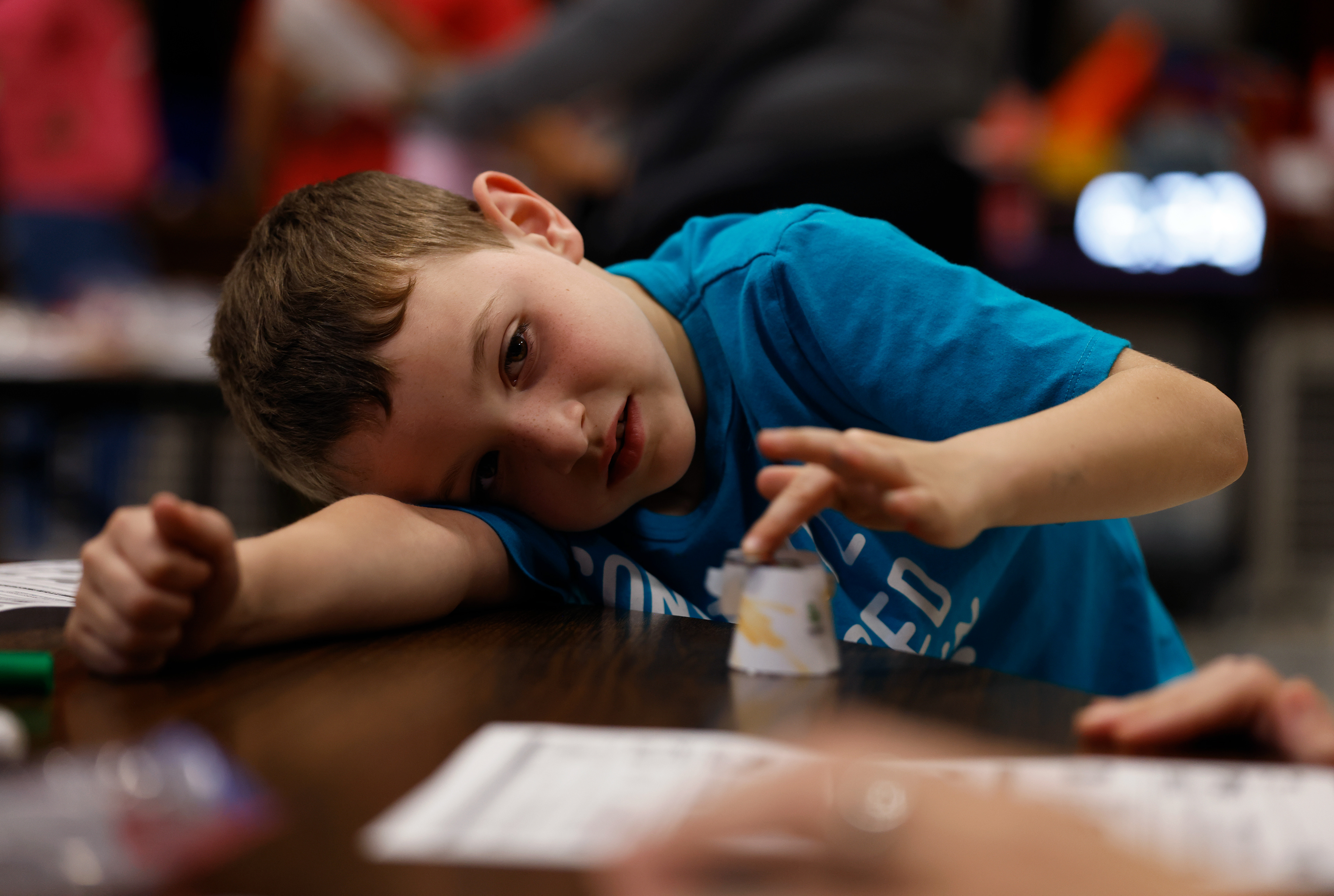 Benton first grader Lucas Borgmann, 6, builds a robot with his mother, Elizabeth Lightle, at a STEAM night event on May 7 at Benton STEM Elementary School in Columbia. “We’re here because we’re having fun, I think,” Lucas said.