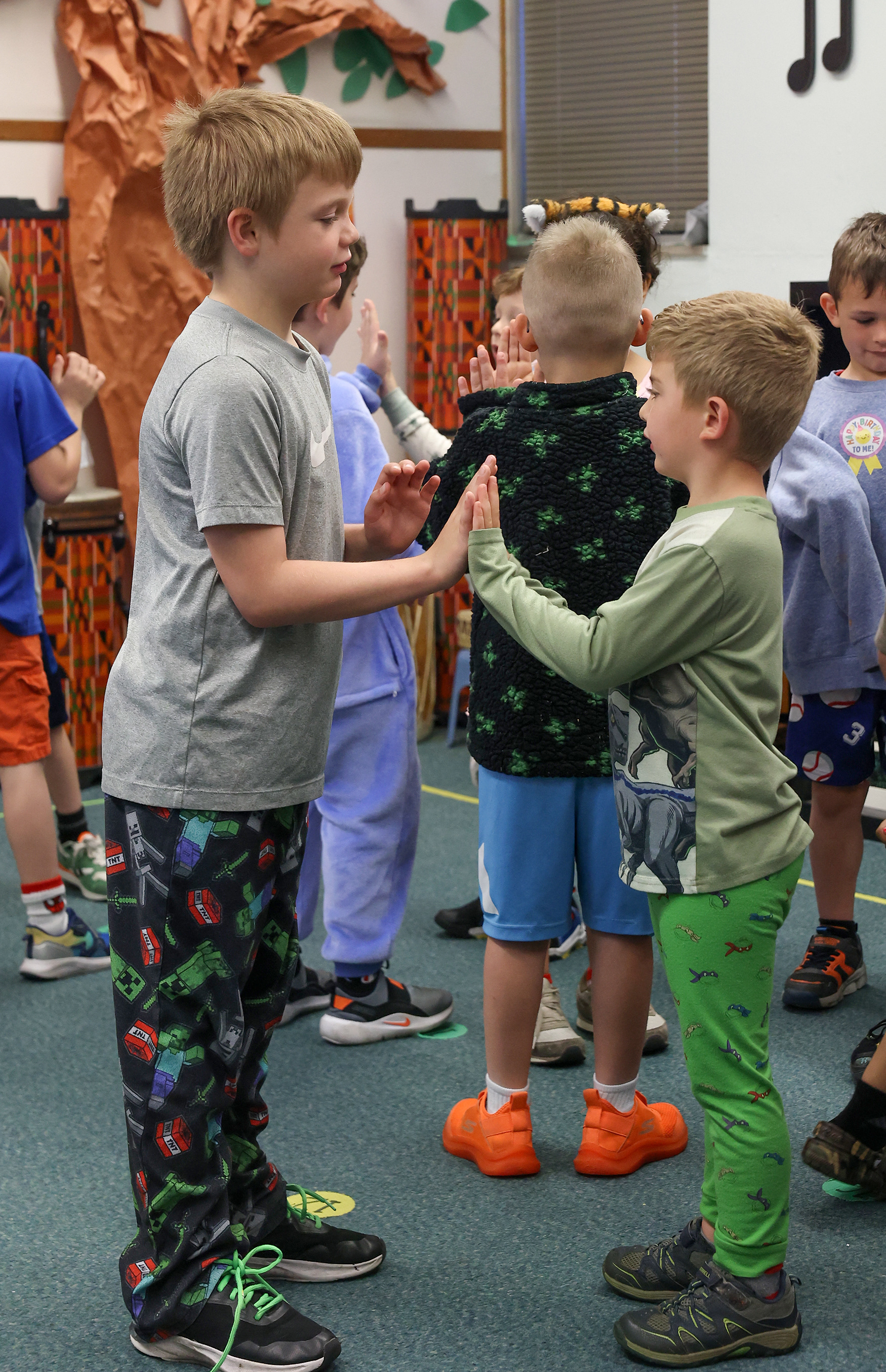 From left, Benjamin Schubert, 7, and Zachary Johnson, 5, practice their folk dance during music class on April 16 at Ridgeway Elementary School. This unit of students performed their dance for other students and staff in mid-April for the school’s folk dance day. Ridgeway, Columbia’s oldest lottery school, focuses on the idea of collaboration between grades.