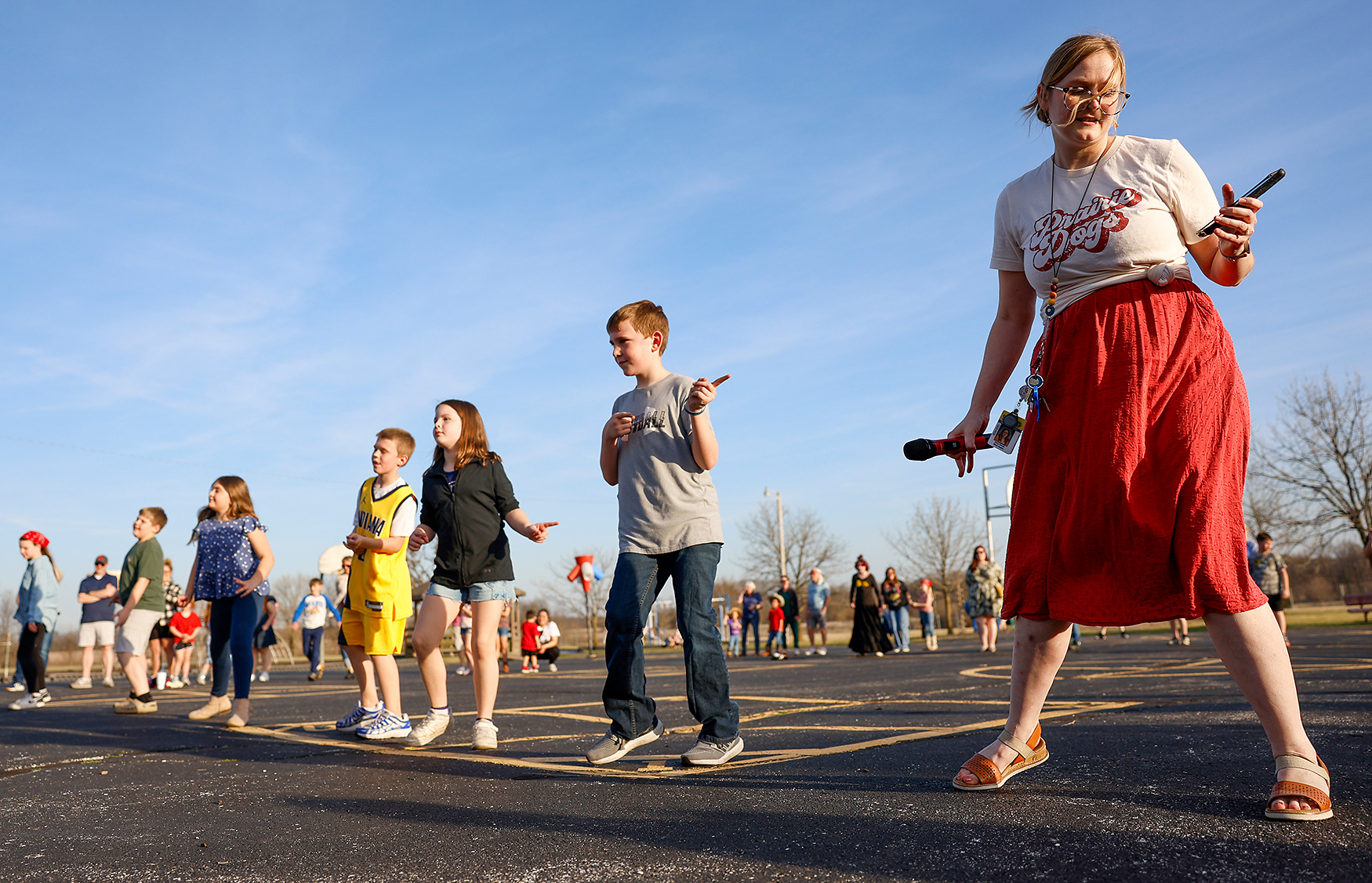 Abby Meeds, the vocal music teacher at Two Mile Prairie Elementary School, leads the Cotton Eye Joe Line Dance on March 19 at Two Mile Prairie Elementary School. “We do a number of different folk dances from around the world,” Meeds said. “We’ve got a lot of Irish folk dances. We’ve got some dances from South America and Africa as well.”
