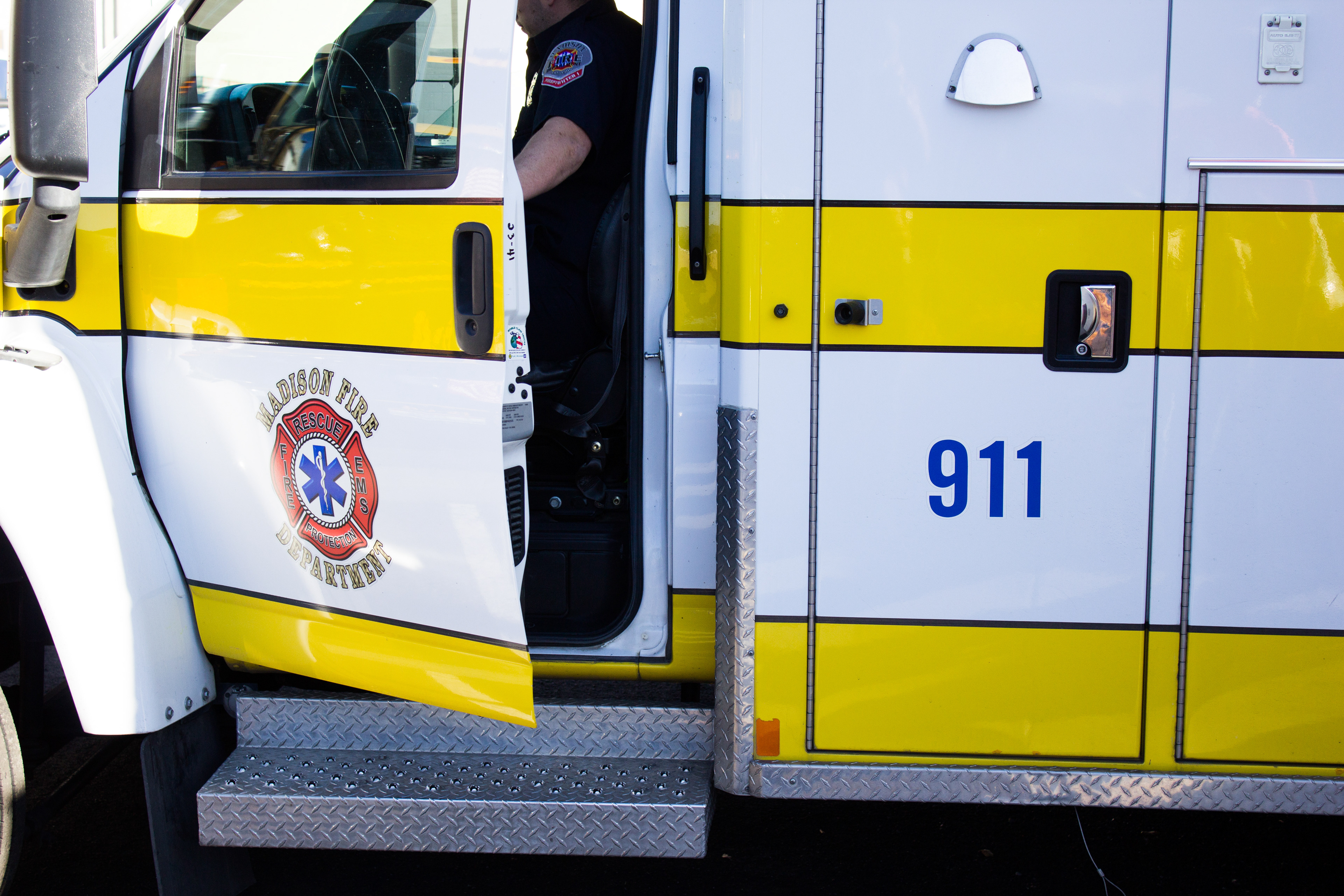 Paramedic entering an ambulance.