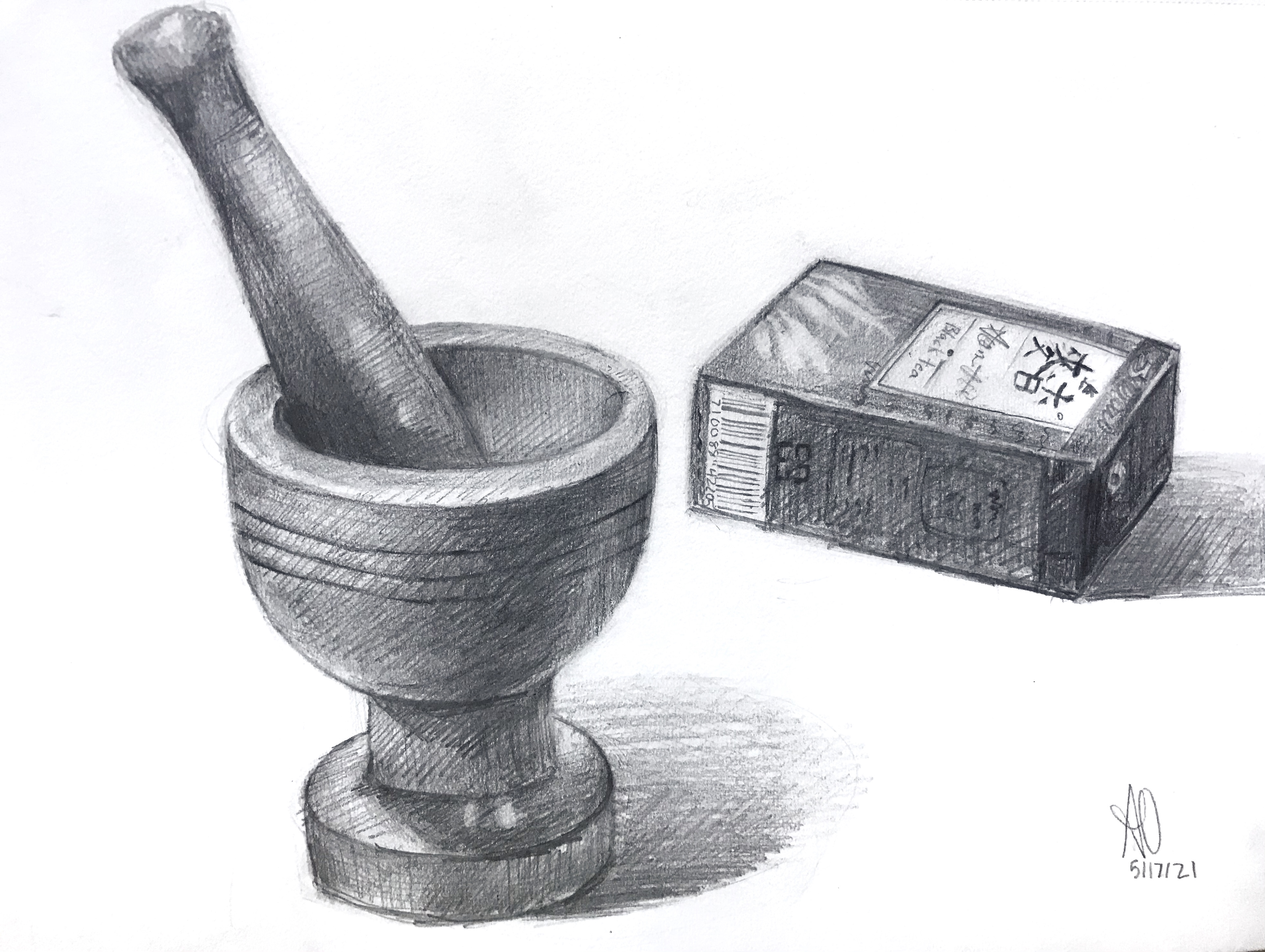Mortar and tea bag box still life