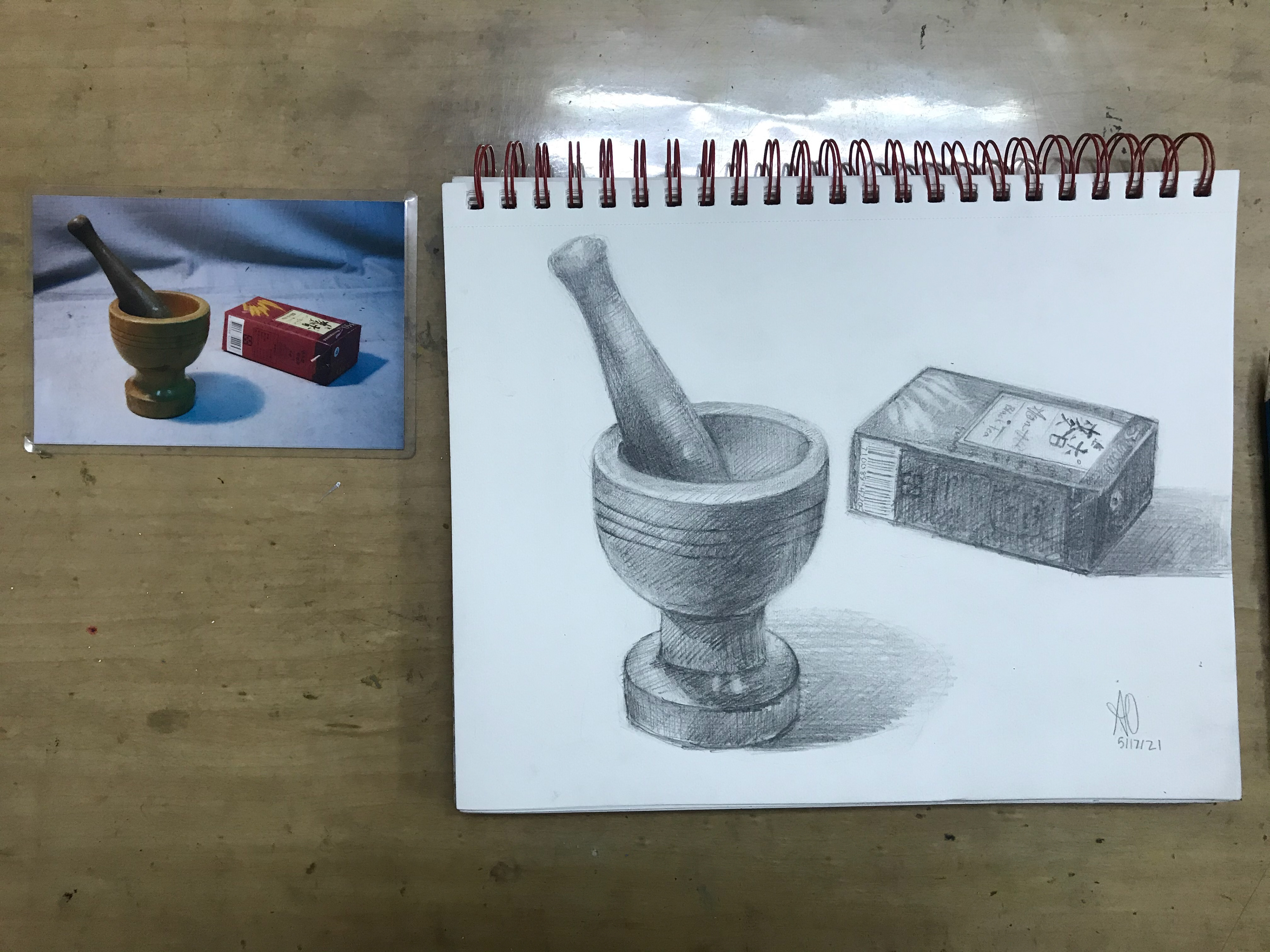 Mortar and tea bag box still life