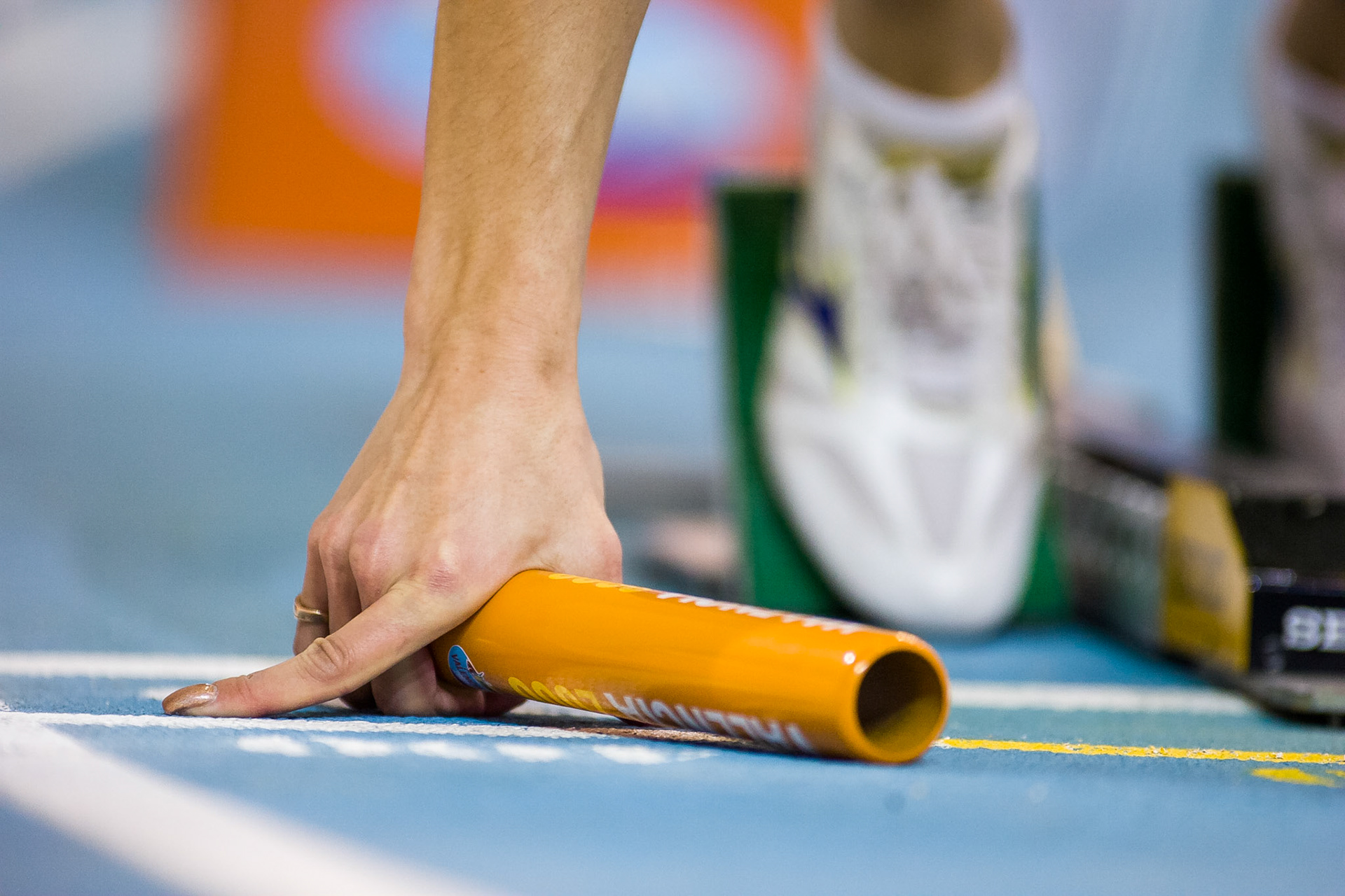 Hand with relay baton