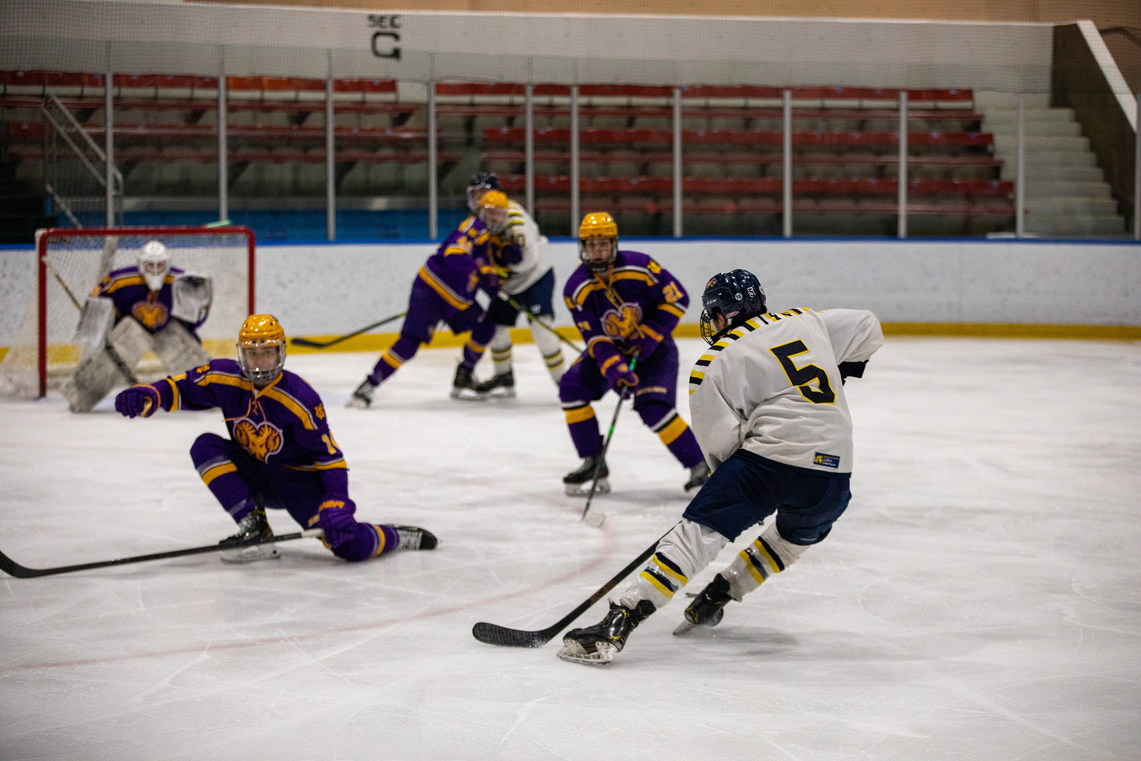 Drexel D1 Forward #5 Nick Castura splits the defense with a strong fake against West Chester University on 02/24/2023.
