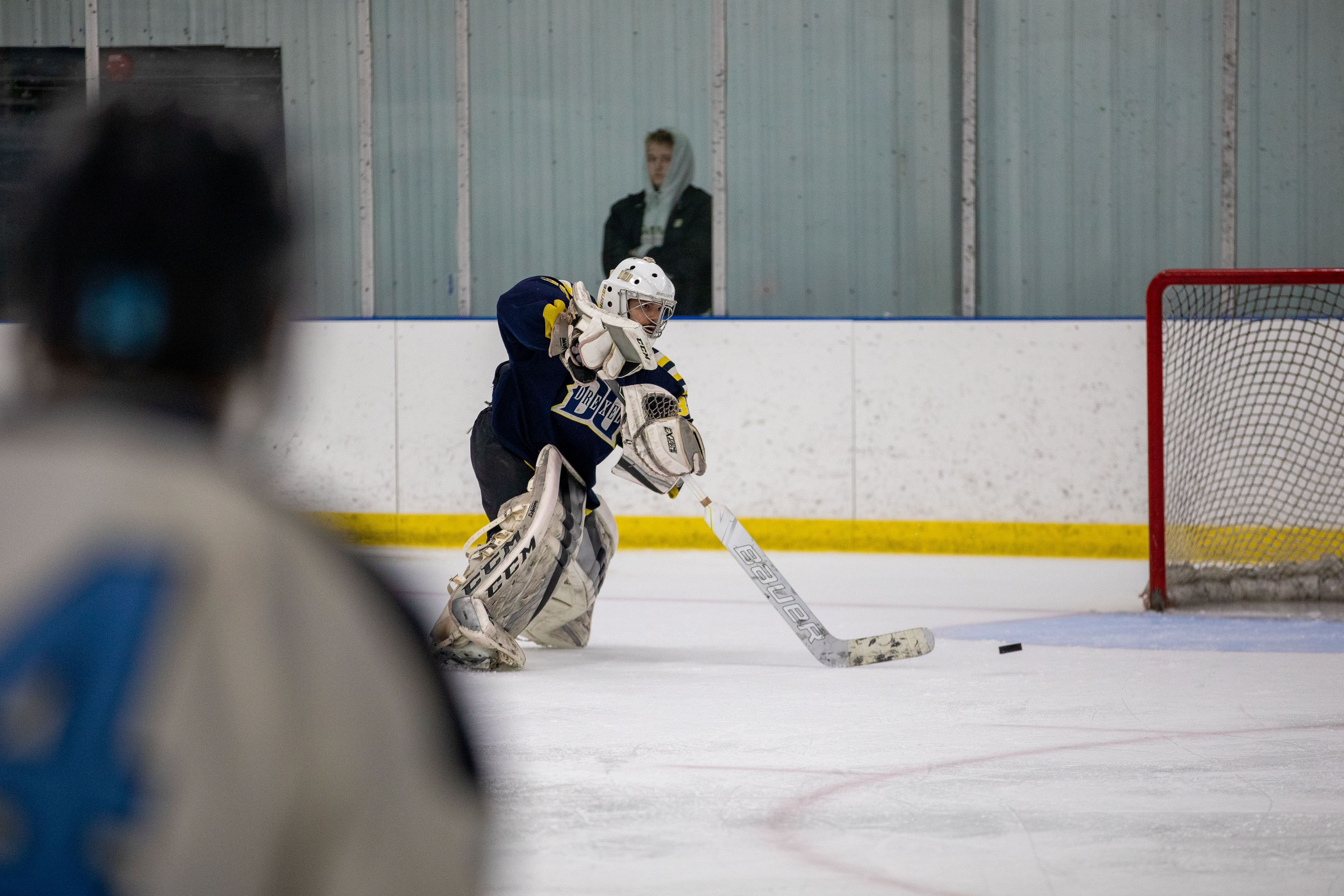 Drexel D1 Goalie #35 Logan Kramsky makes a pass to a Drexel Defenseman against the University of Rhode Island on 03/04/2023.