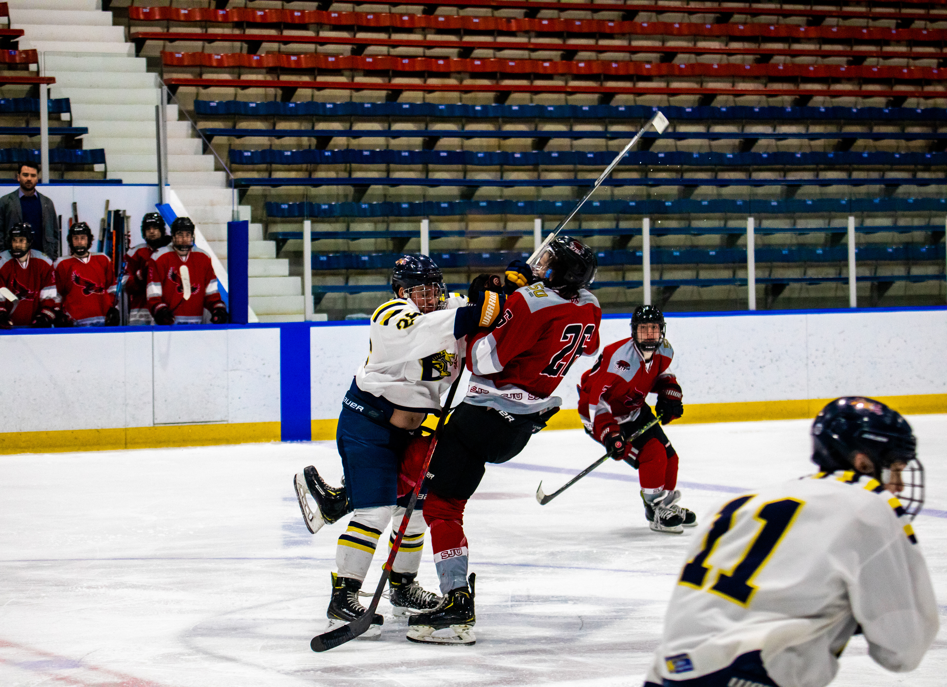 Drexel D2 Captain #26 Mark Lewery lays a massive hit on a St. Joes' University Defenseman on 01/21/2023.