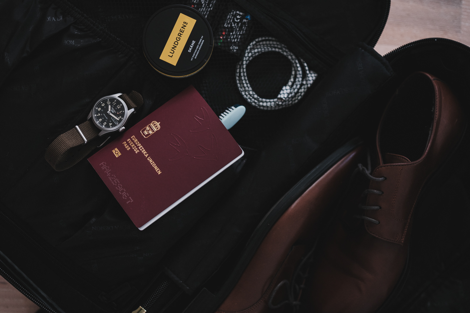 The essentials. Watch. Passport. Tobacco.