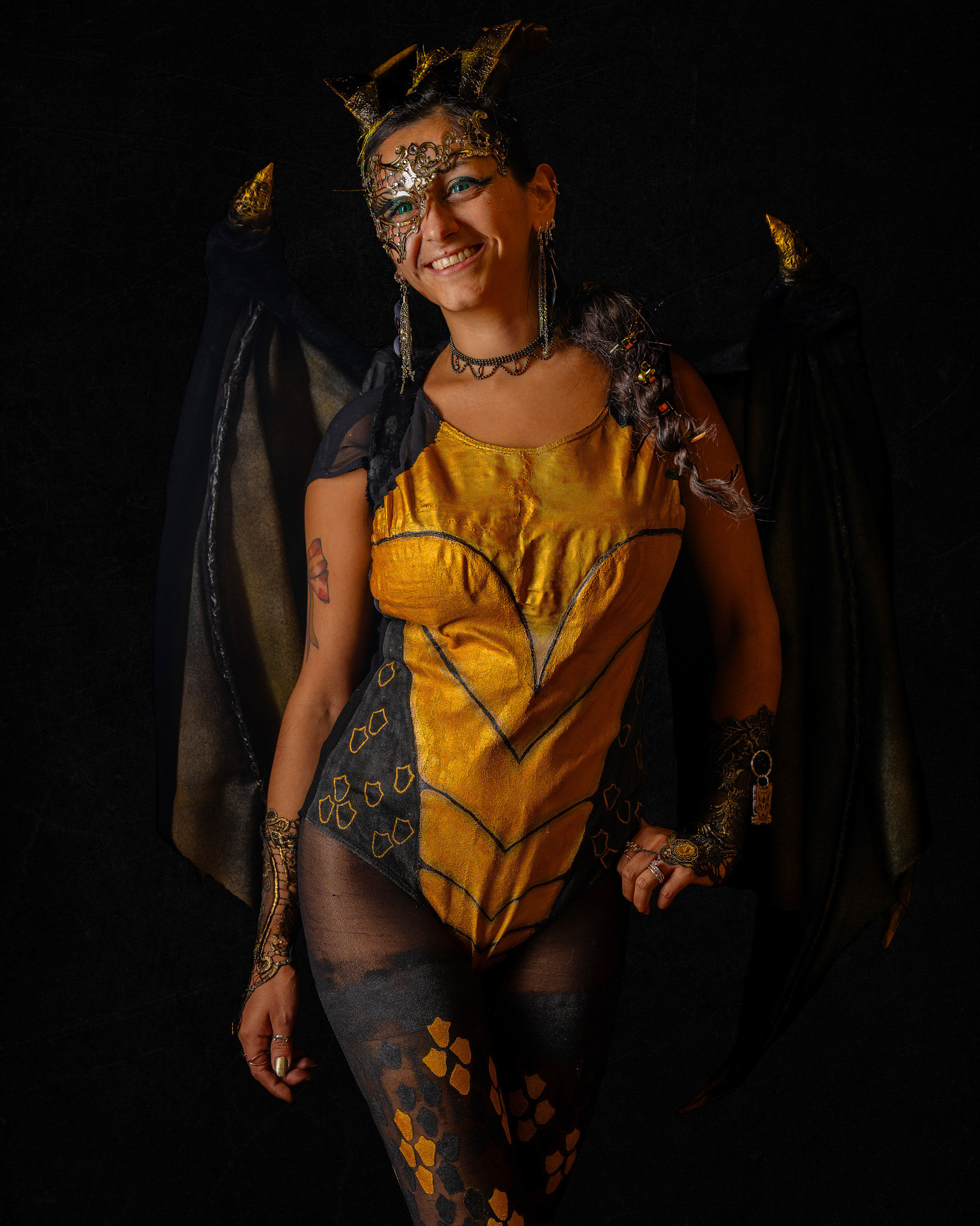 Studio cosplay portrait of model Maribel wearing a detailed fantasy costume with dramatic lighting