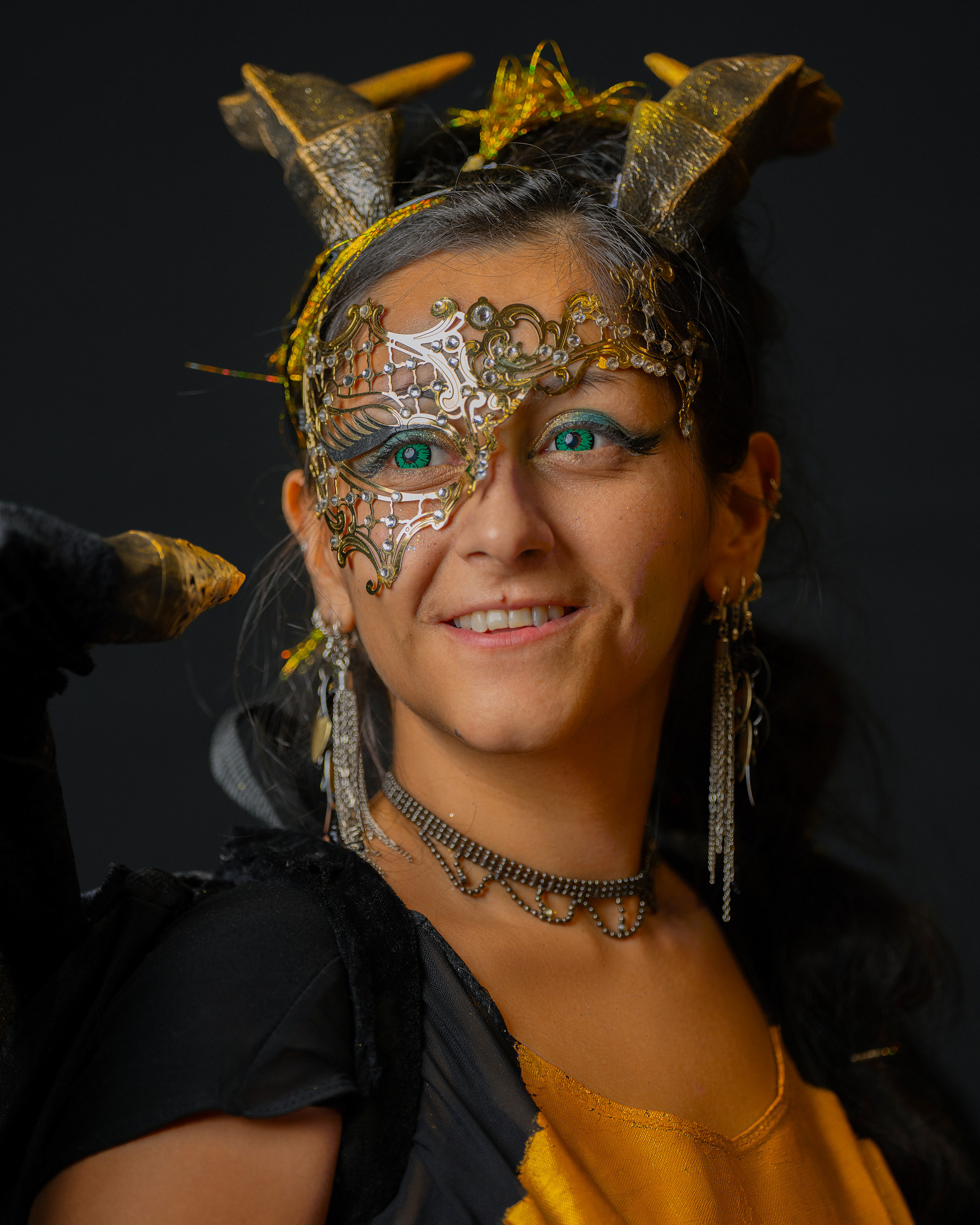 Close-up cosplay portrait of Maribel showcasing detailed fantasy mask and character styling