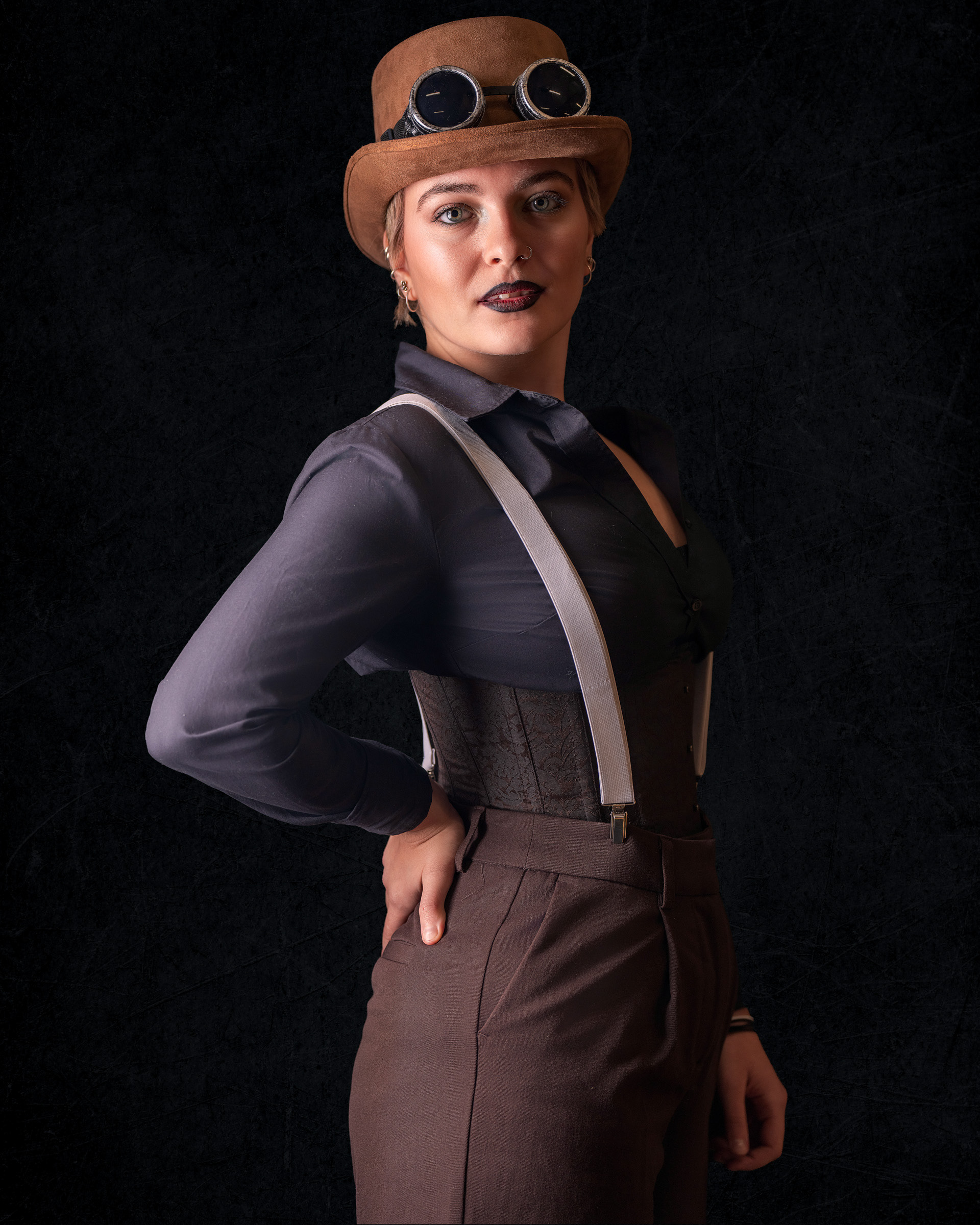 Side profile steampunk cosplay portrait of Tirza in professional studio setup