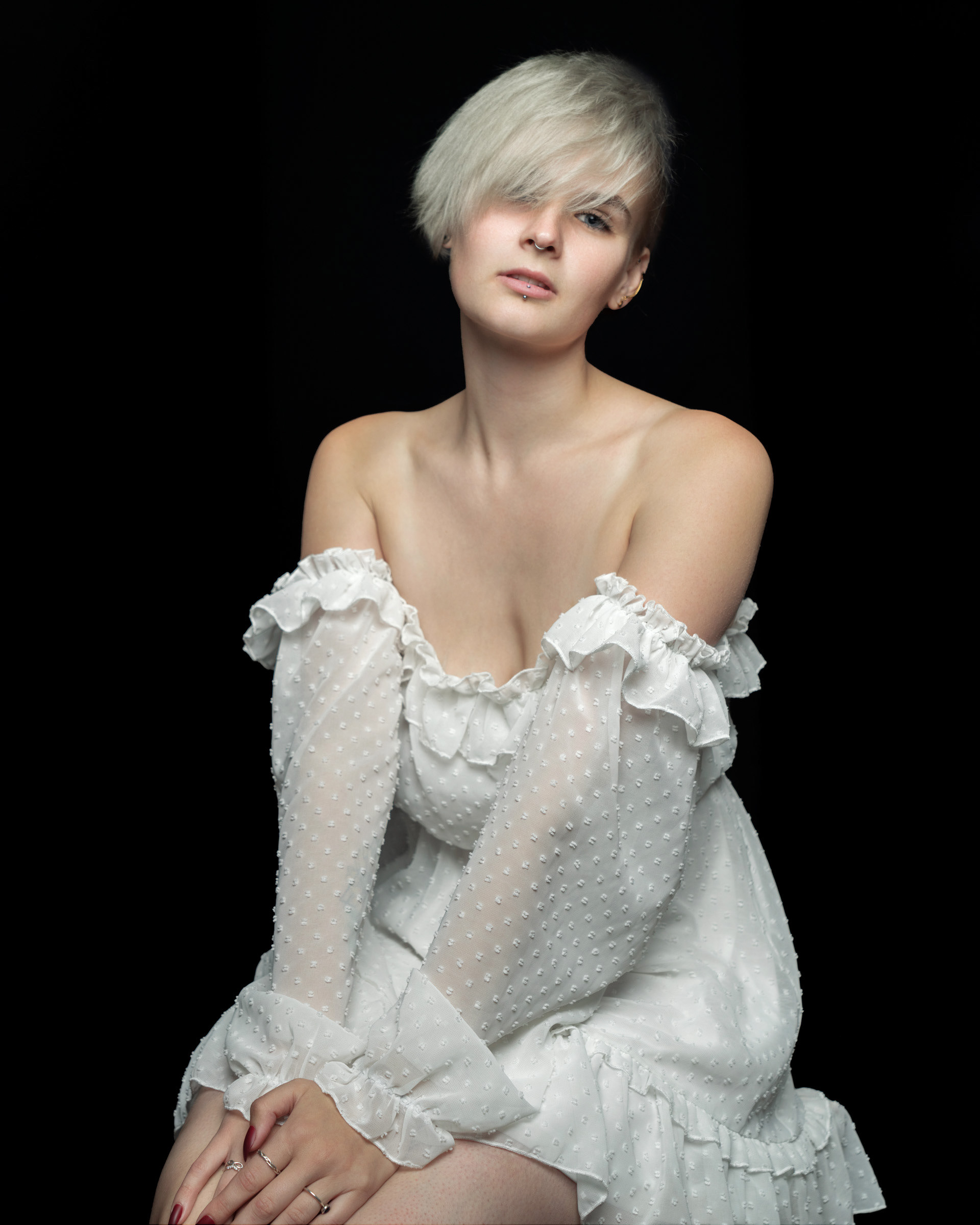 Fashion studio portrait of Sisse in elegant white dress with clean background