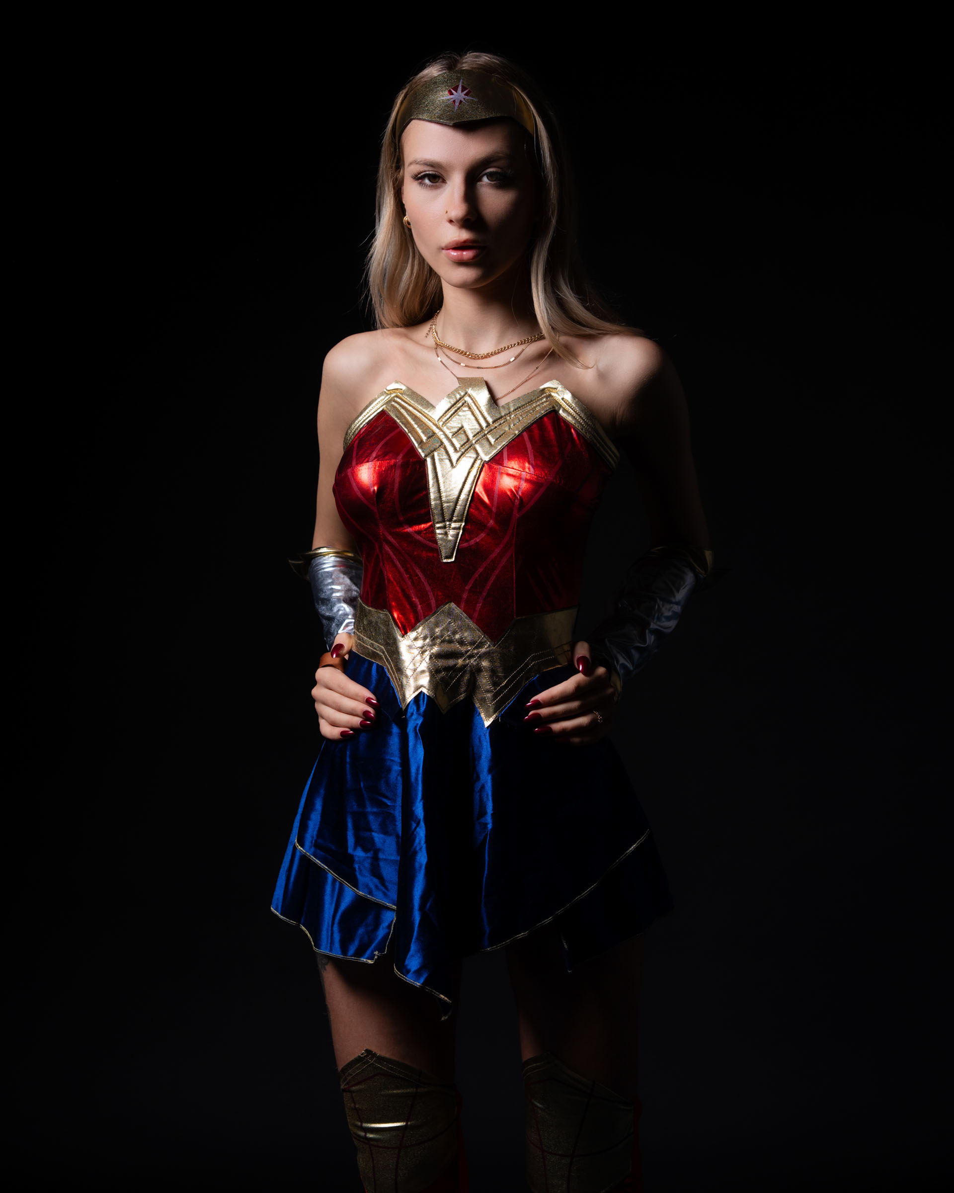 Full-body portrait with dramatic superhero presence.