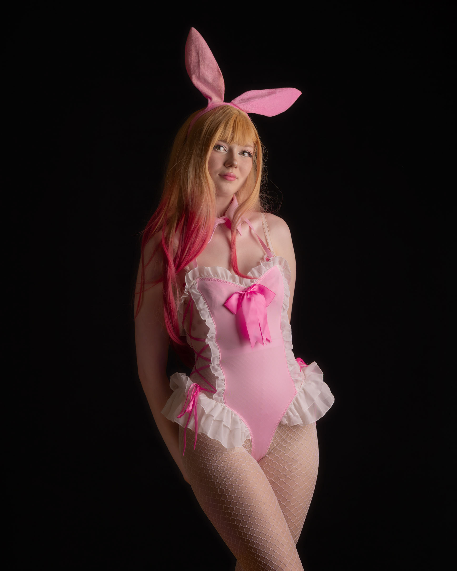 Pastel-themed bunny cosplay with Ninu, standing pose with long wig and delicate outfit details.