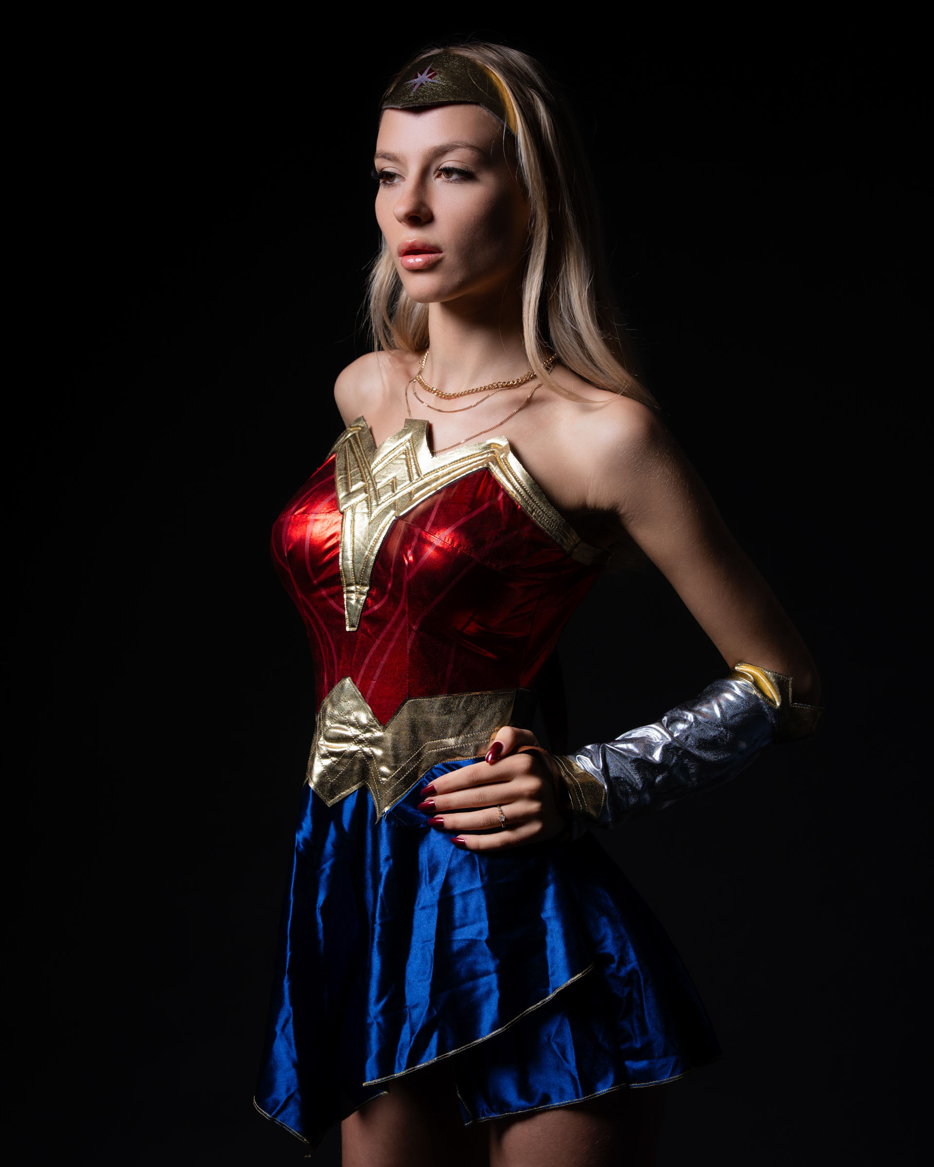 Detail shot of gauntlets, belt and iconic color palette.