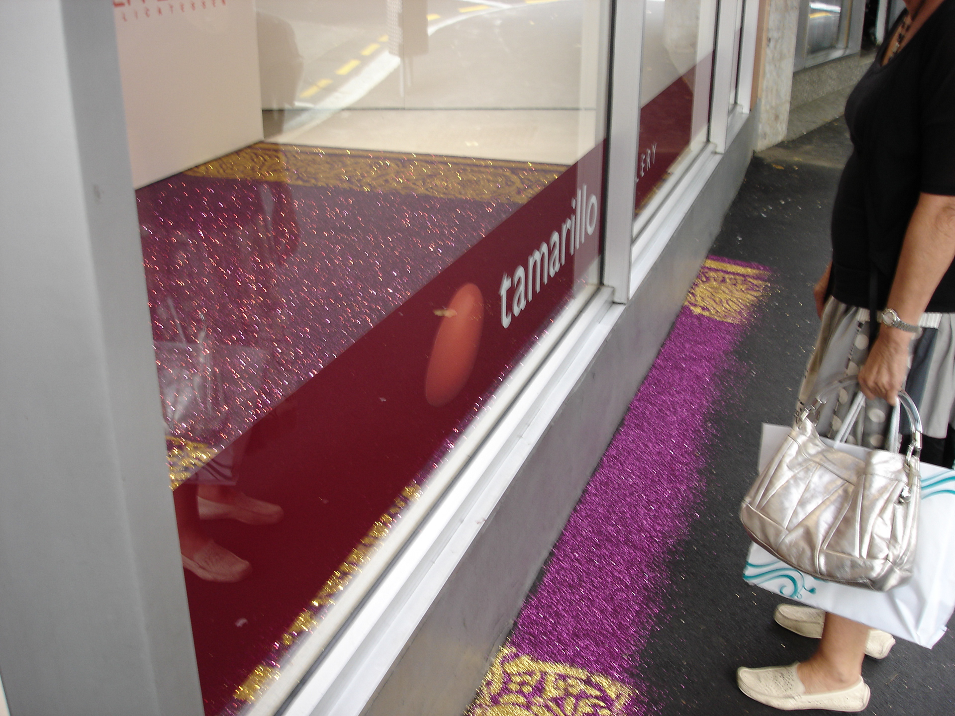 Temporal glitter carpet installation outside gallery window on footpath