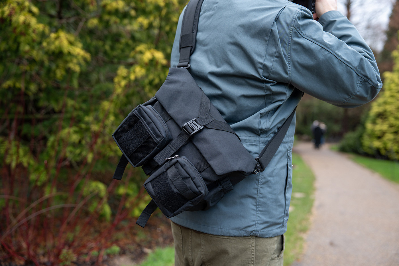 Showing the crossbody bag from the rear
