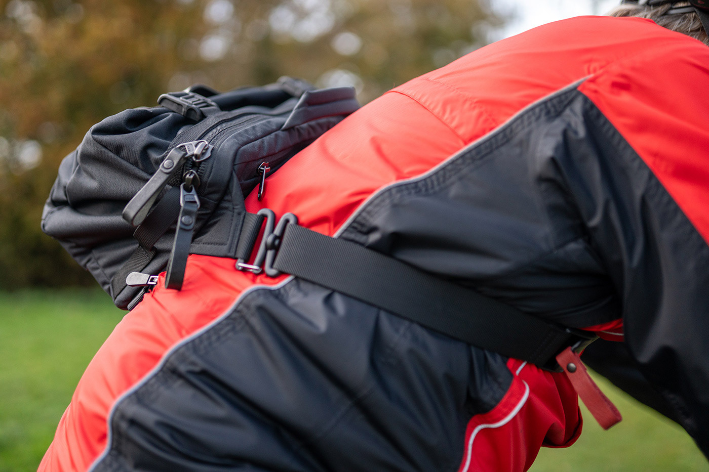 Cycling with camera sling bag securely attached