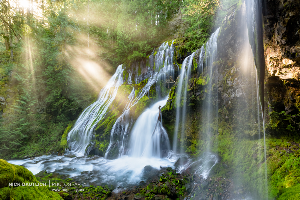 Incredible waterfall with spray lighting up behind cascade in Washington