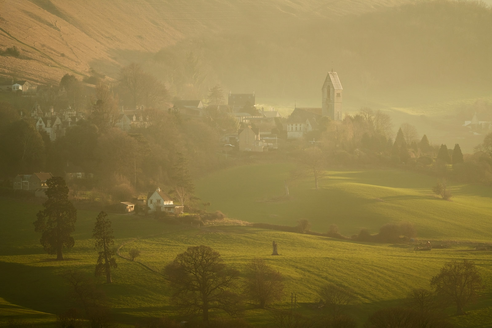 Sunlight on Gloucestershire misty scene