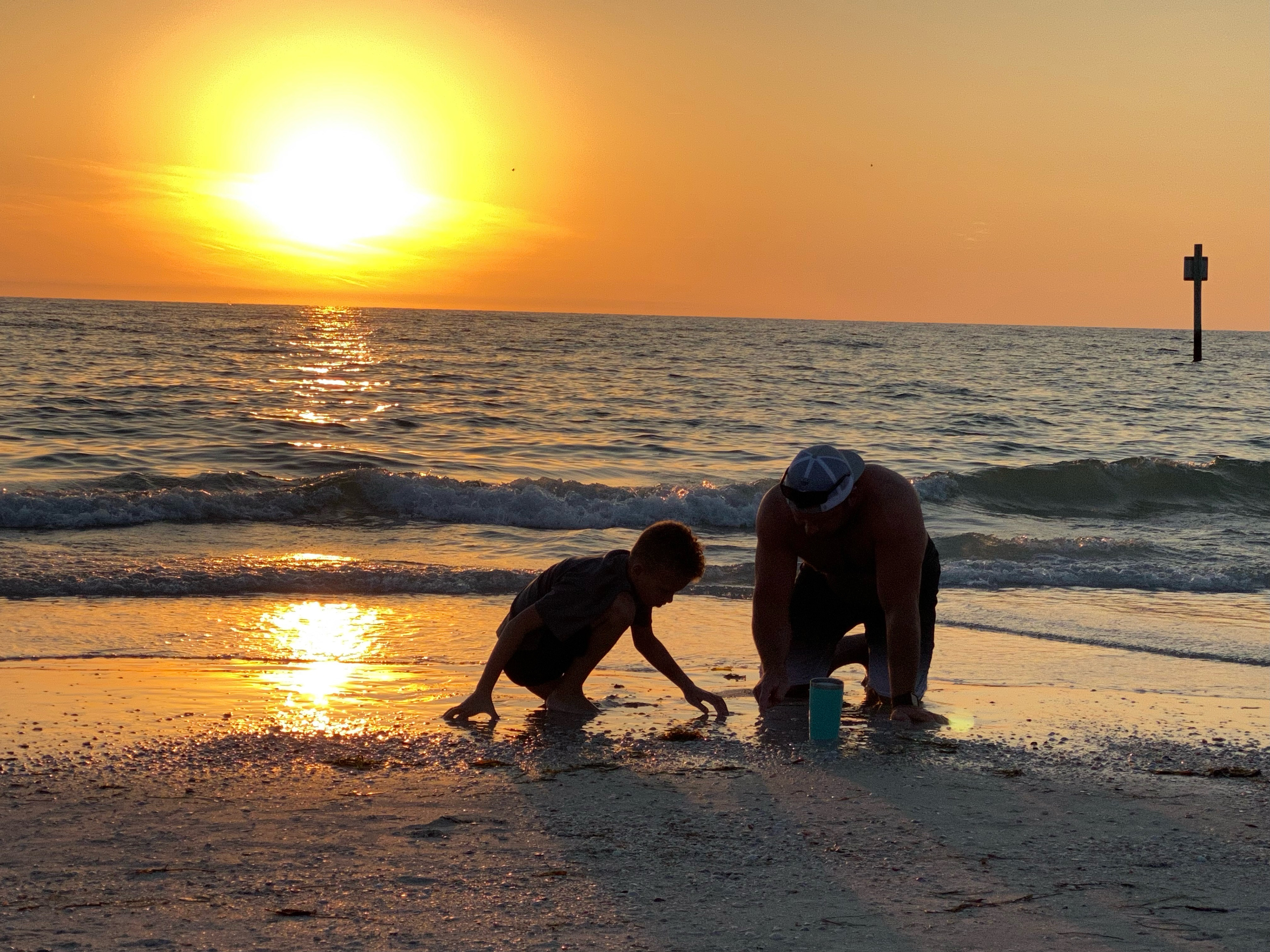 Silhouette of Father and Child at Sunset on Clearwater Beach Florida