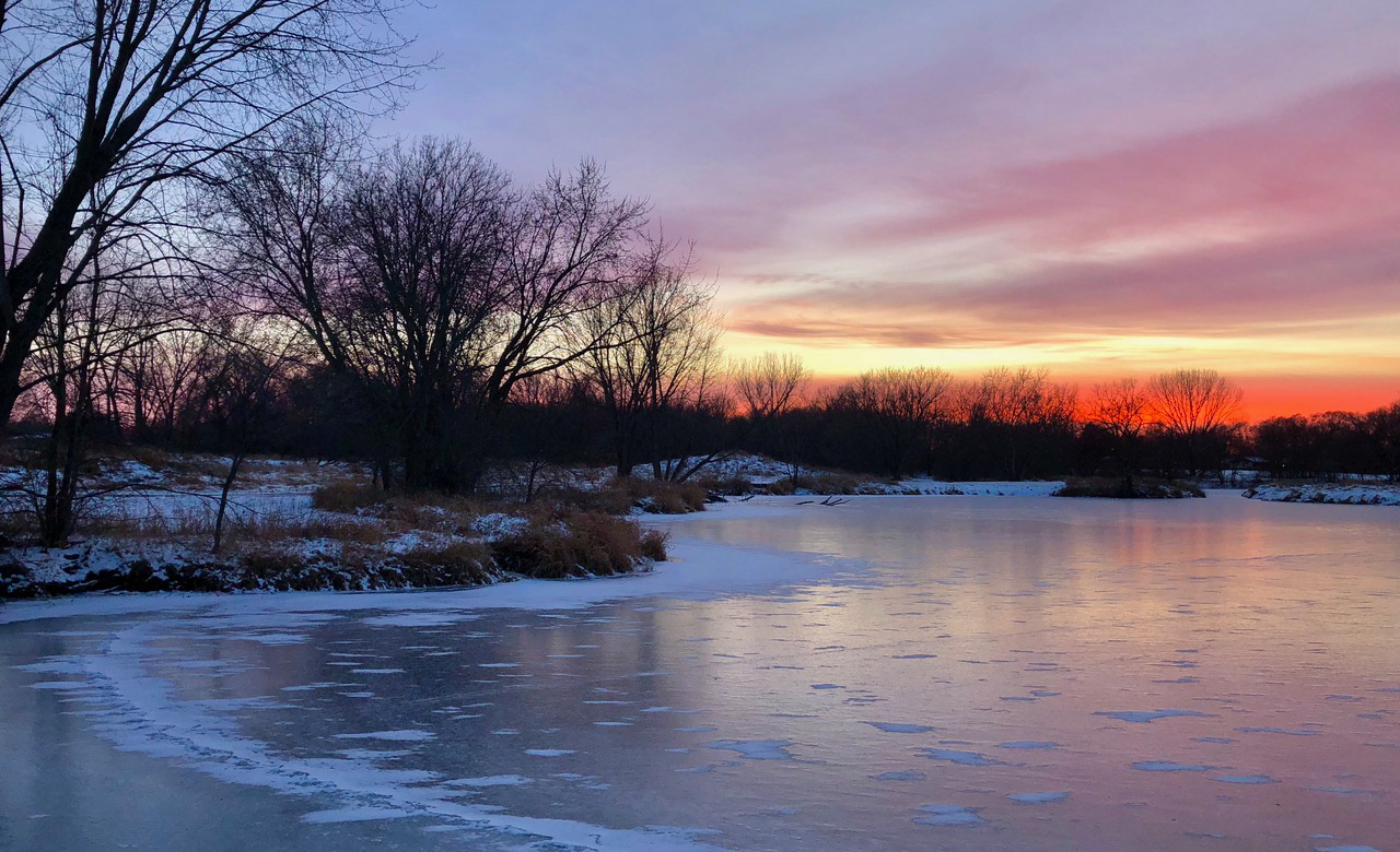 Warm Sunset Glow Over Frozen Brookdale Park Pond in Brooklyn Park Minnesota