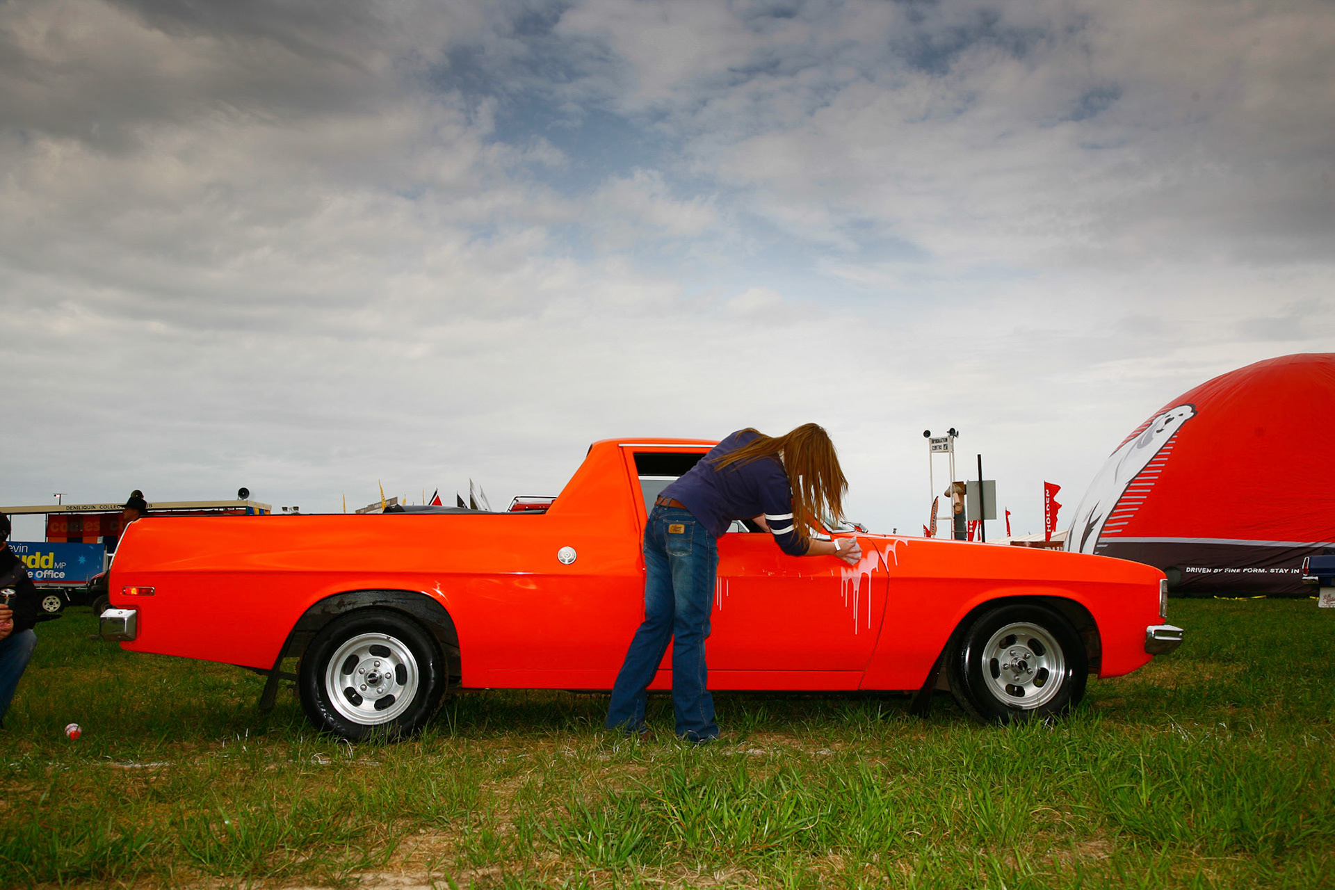 17 year old girl polishes her utes at Deniliquin Ute Muster. October 2, 2009. Deniliquin, NSW.