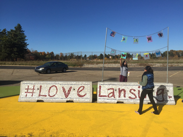 Installation team admires the first completed barrier