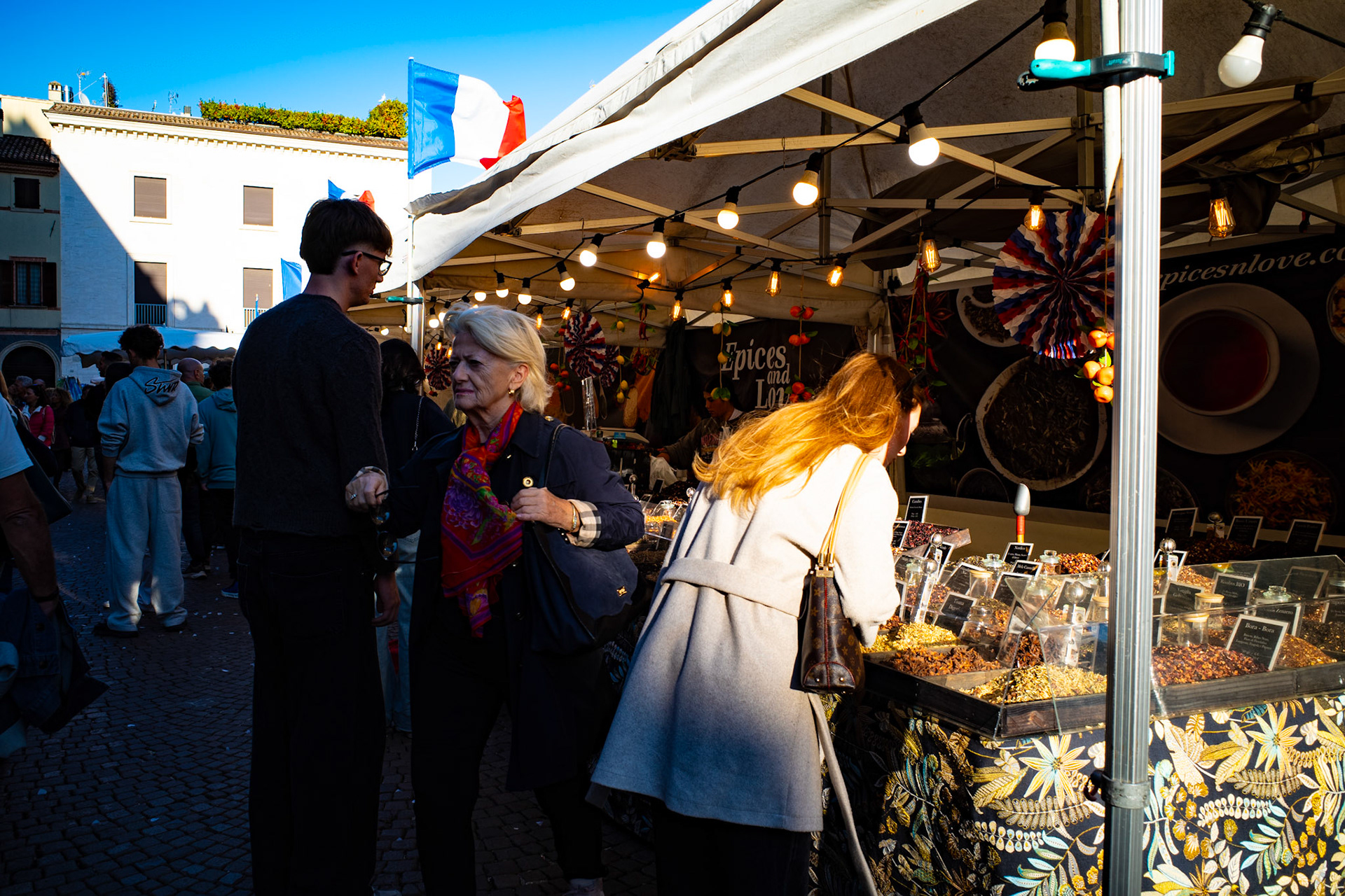 In the scent of spices and light, the city speaks forgotten tongues