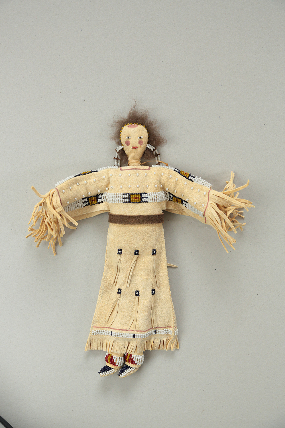 Fig 8 doll, (leather, hair, quill)