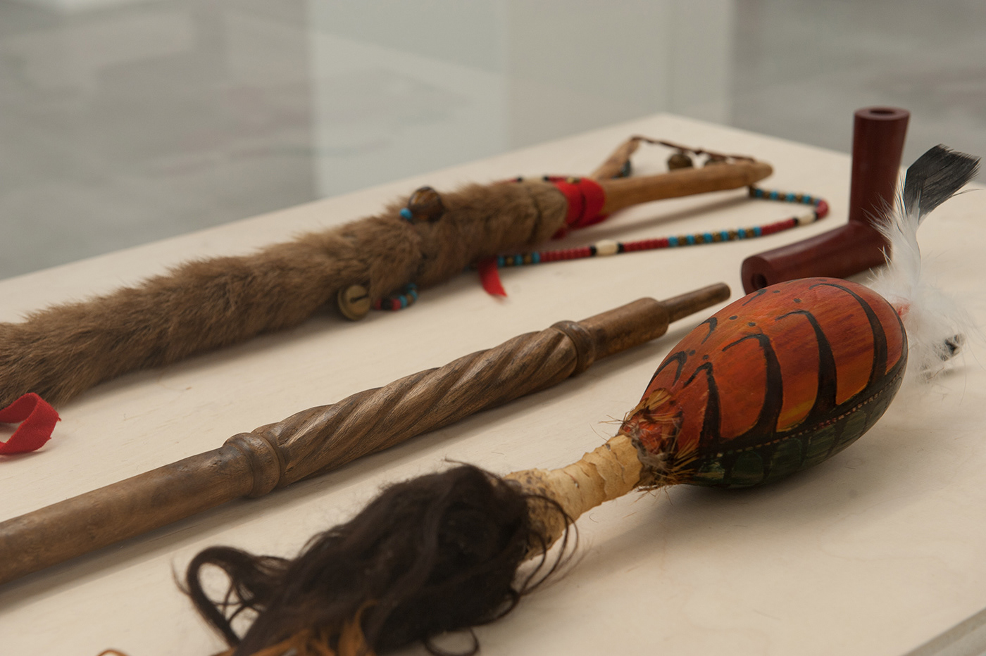 Fig 4: detail: shaman stick, rattle, peace pipe)