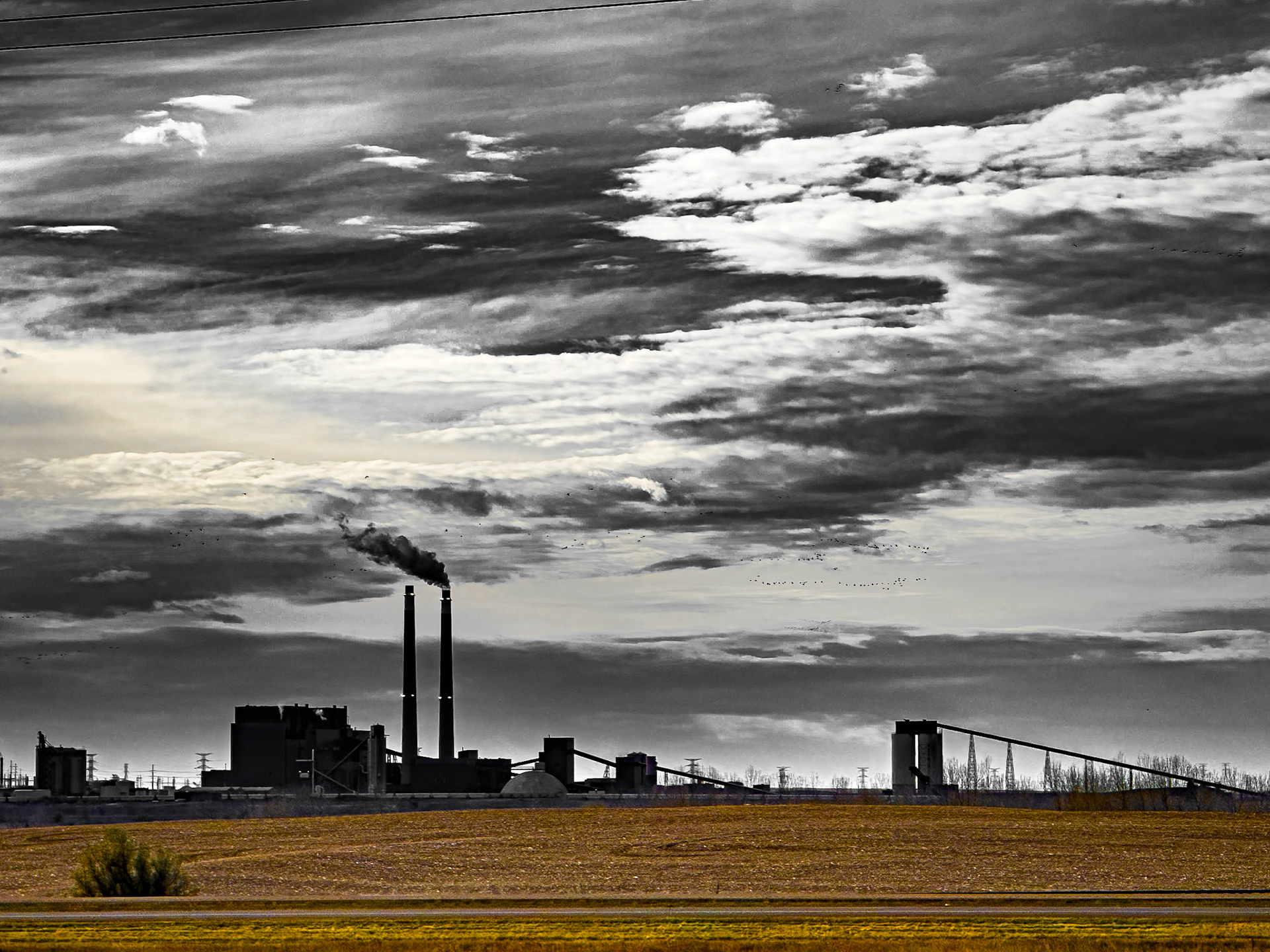 Industrial Power Plant Under Dramatic Skies