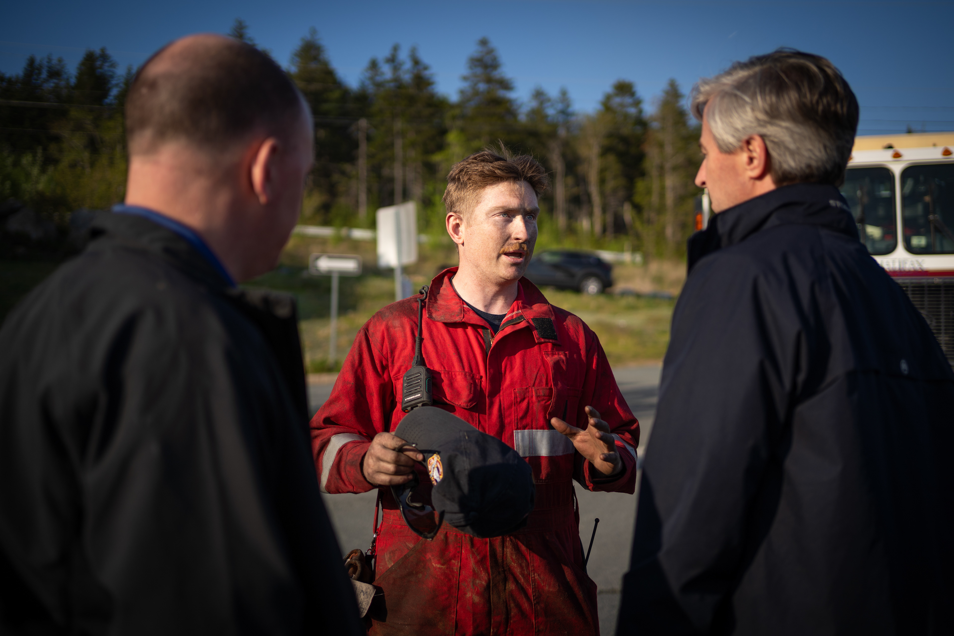 A local firefighter describes fire damage in Upper Tantallon to Premier Houston and Minister Tory Rushton.