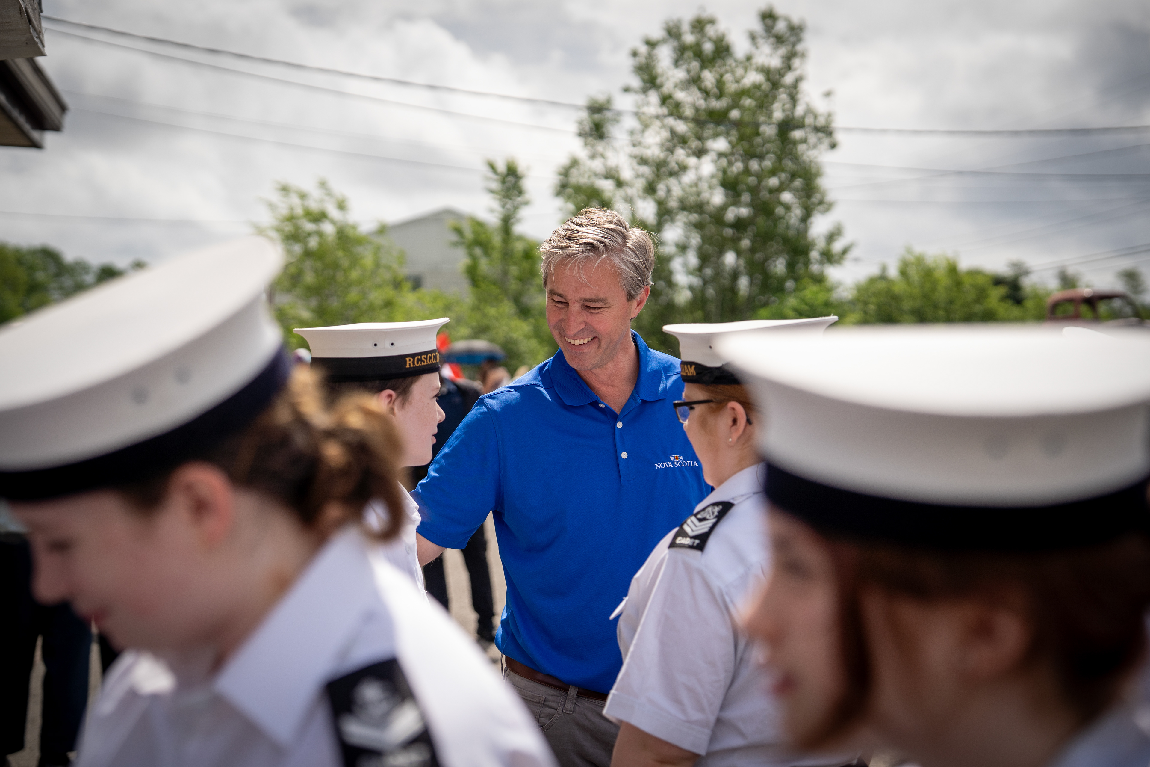 Premier Tim Houston chats with cadets in Westville, Pictou County, on Canada Day 2023.